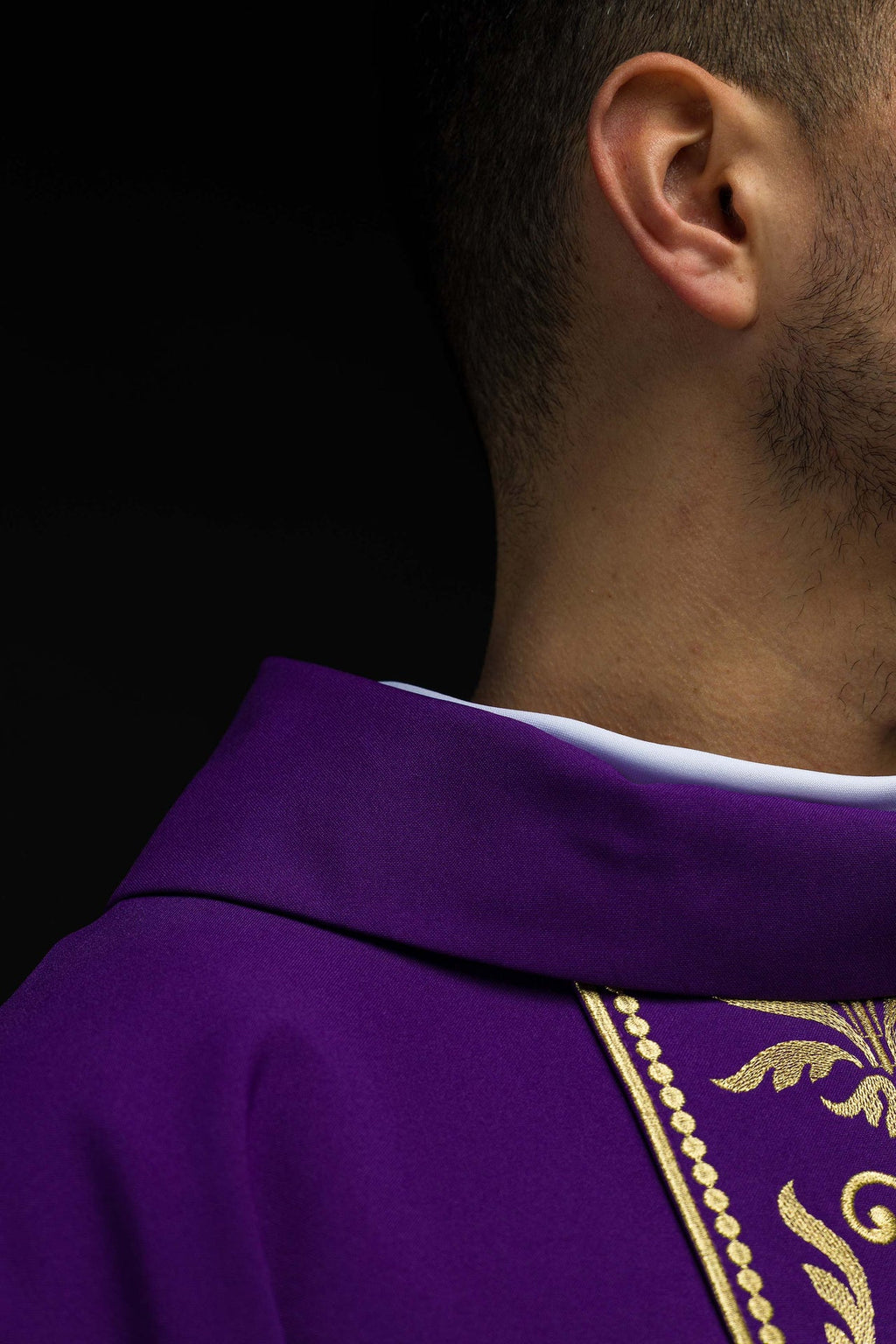 Purple liturgical chasuble decorated with gold embroidered belt