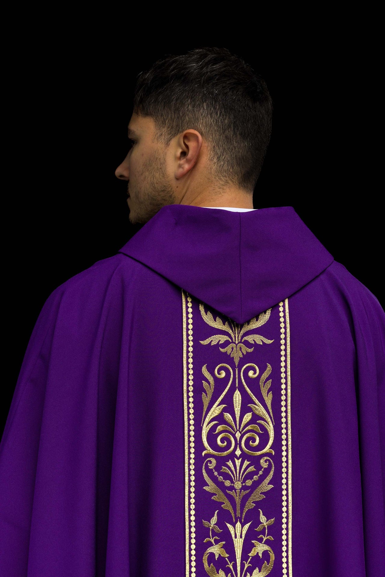 Purple liturgical chasuble decorated with gold embroidered belt