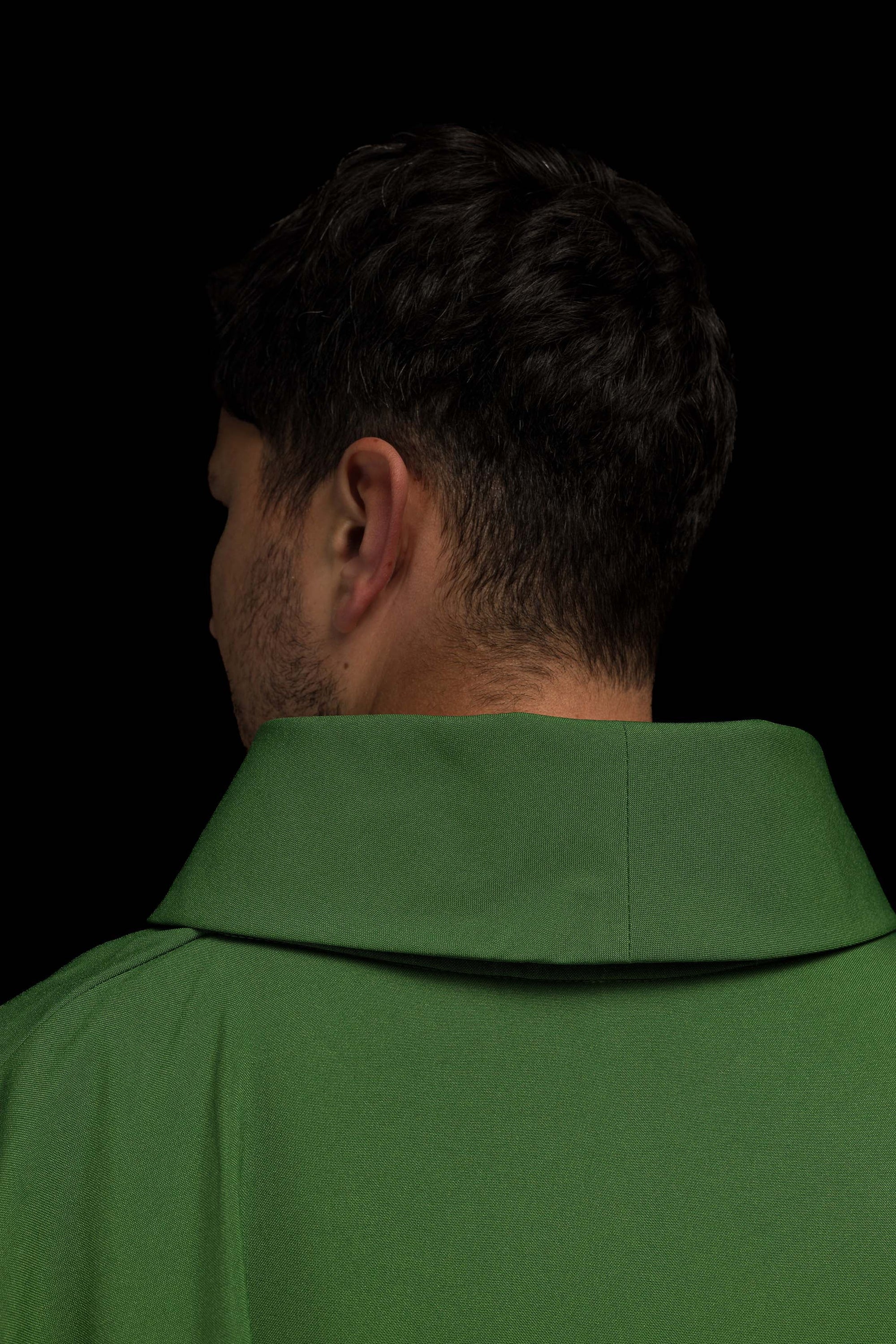 Green embroidered chasuble with gold IHS motif