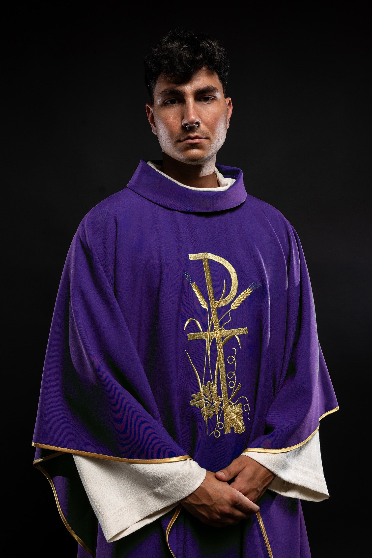 Purple chasuble with gold cross embroidery