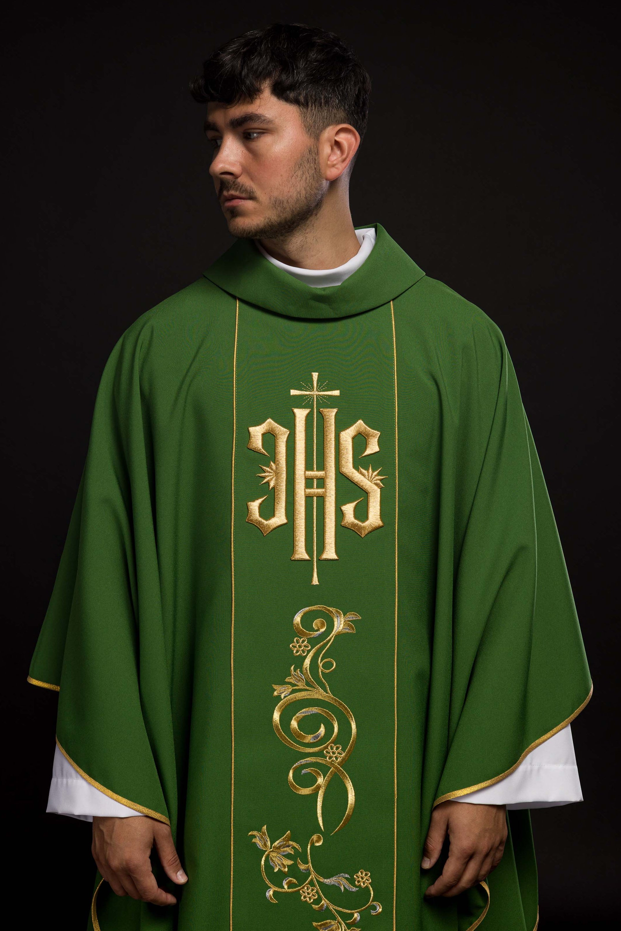 Richly decorated green chasuble with gold motif and wide IHS band