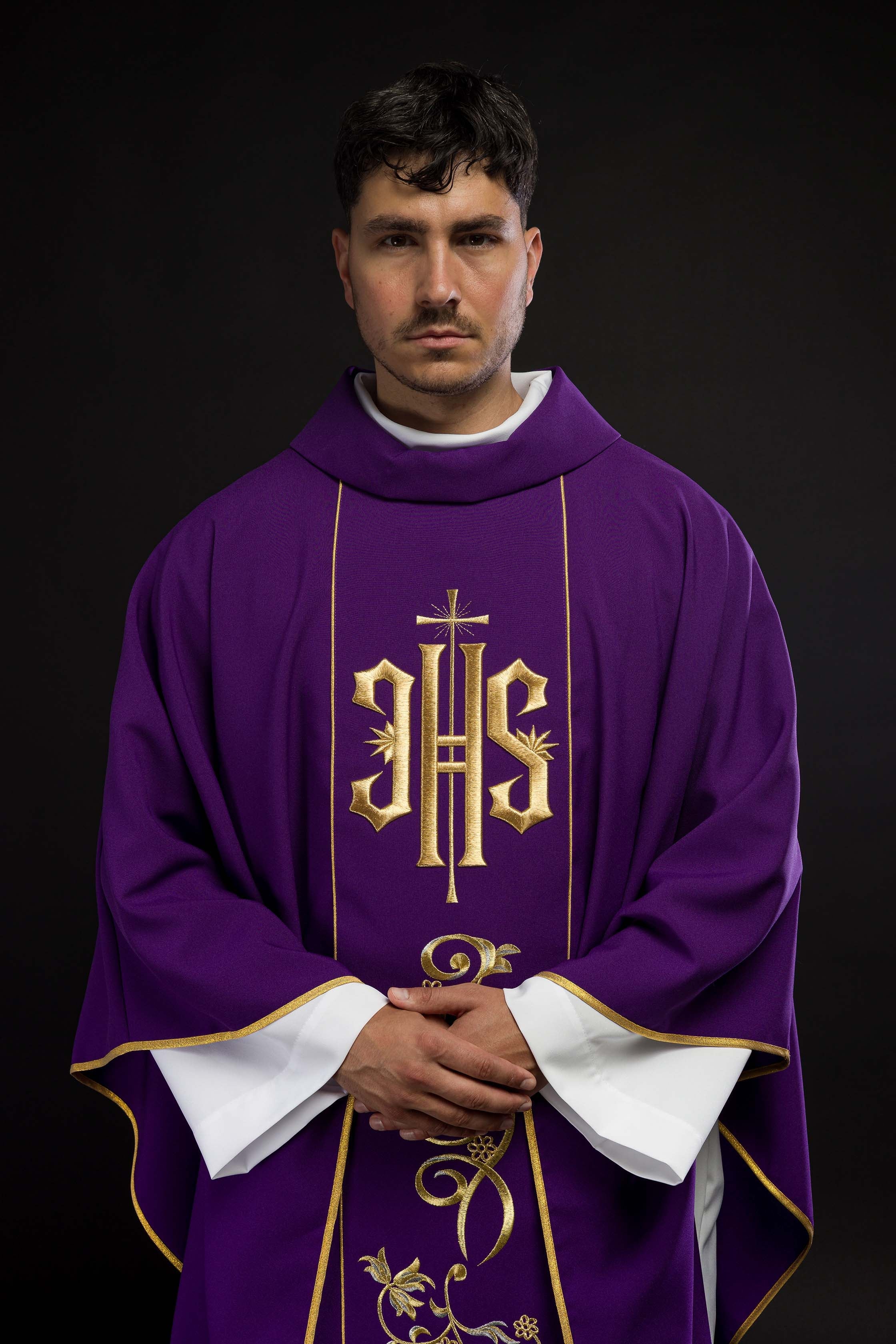 Richly decorated purple chasuble with gold motif and wide IHS band