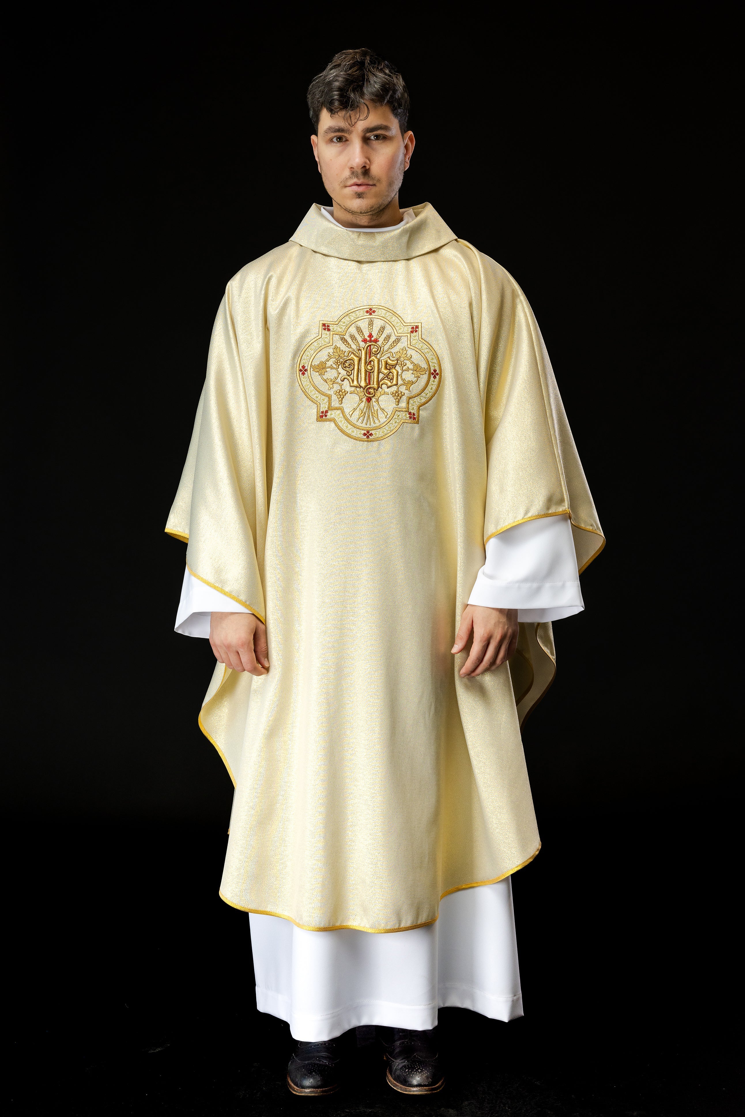 Gold chasuble with IHS and PAX embroidery