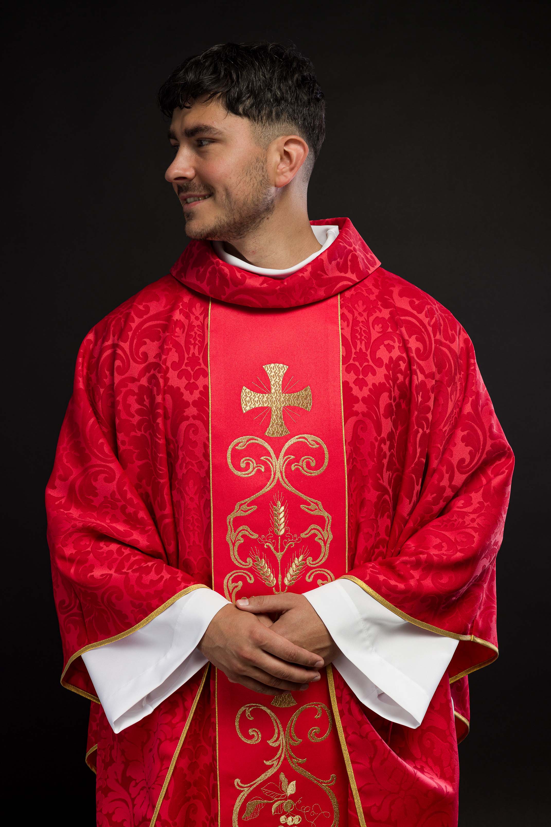 Red liturgical chasuble decorated with embroidered belt