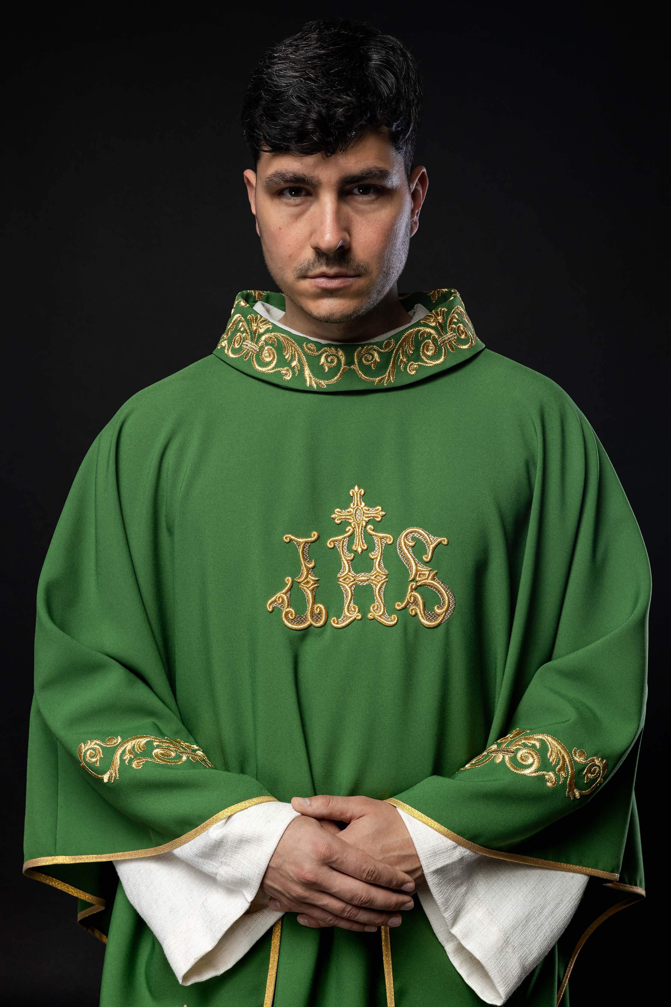 Green chasuble with gold IHS embroidery and decorative trim