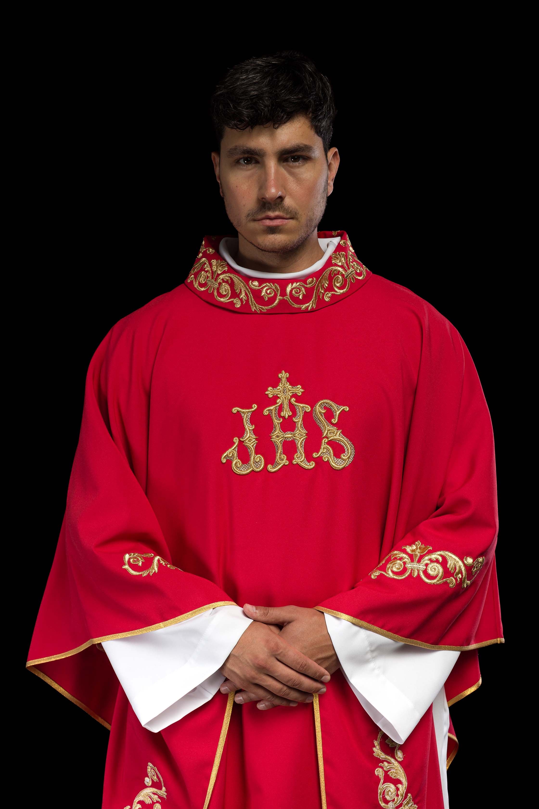 Red chasuble with gold IHS embroidery and decorative trim