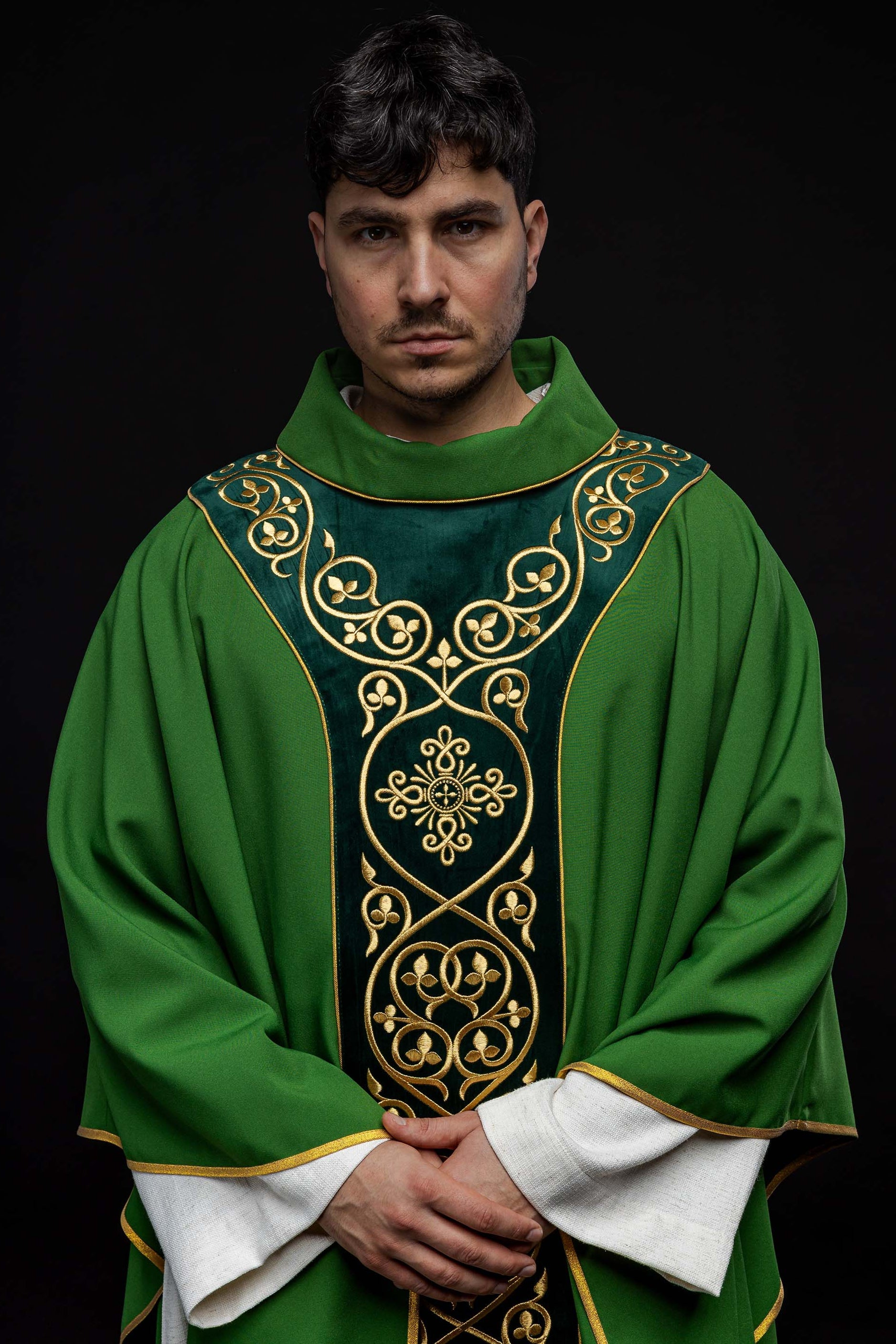 Green liturgical chasuble decorated with embroidery on velvet