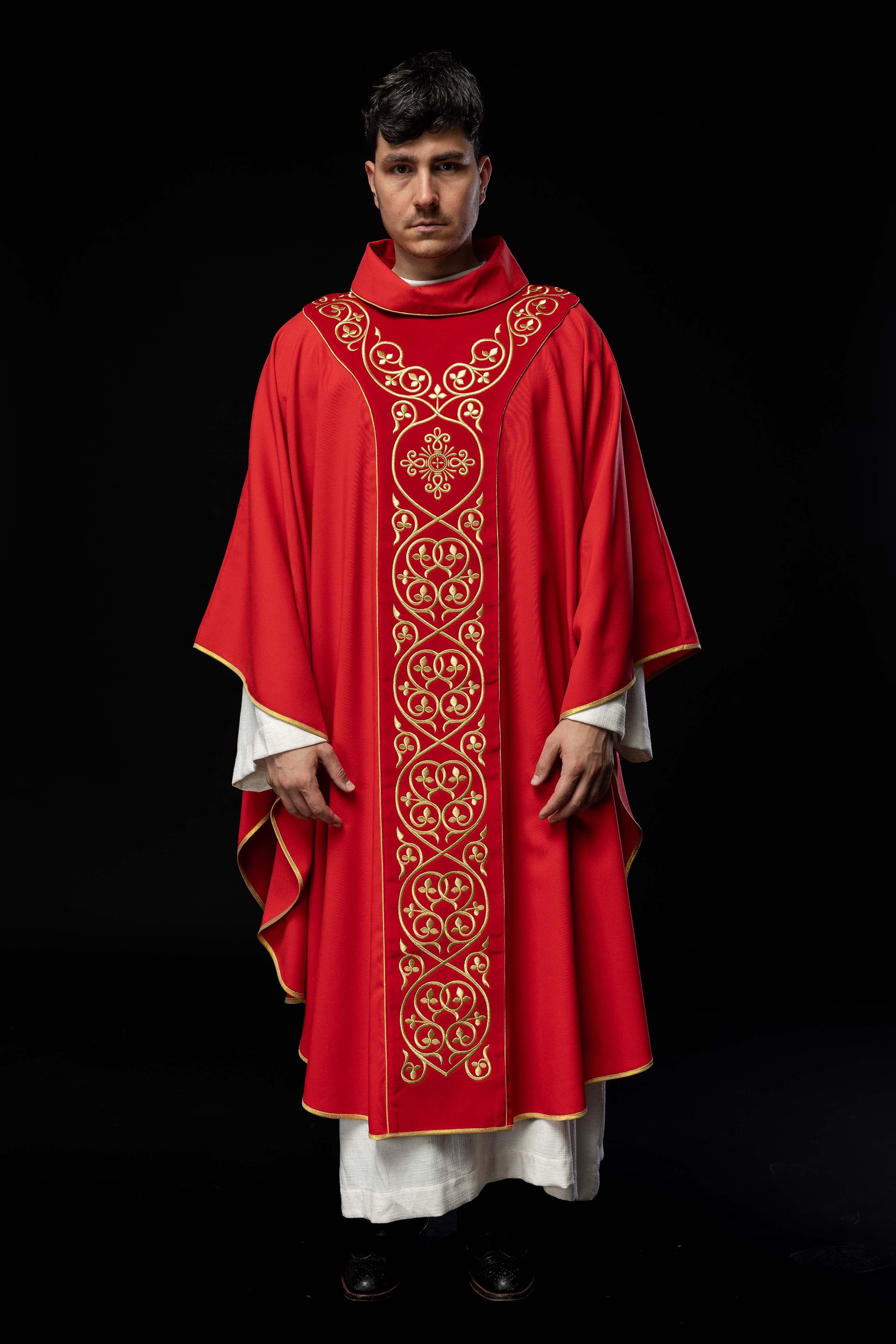 Red liturgical chasuble decorated with embroidery on velvet