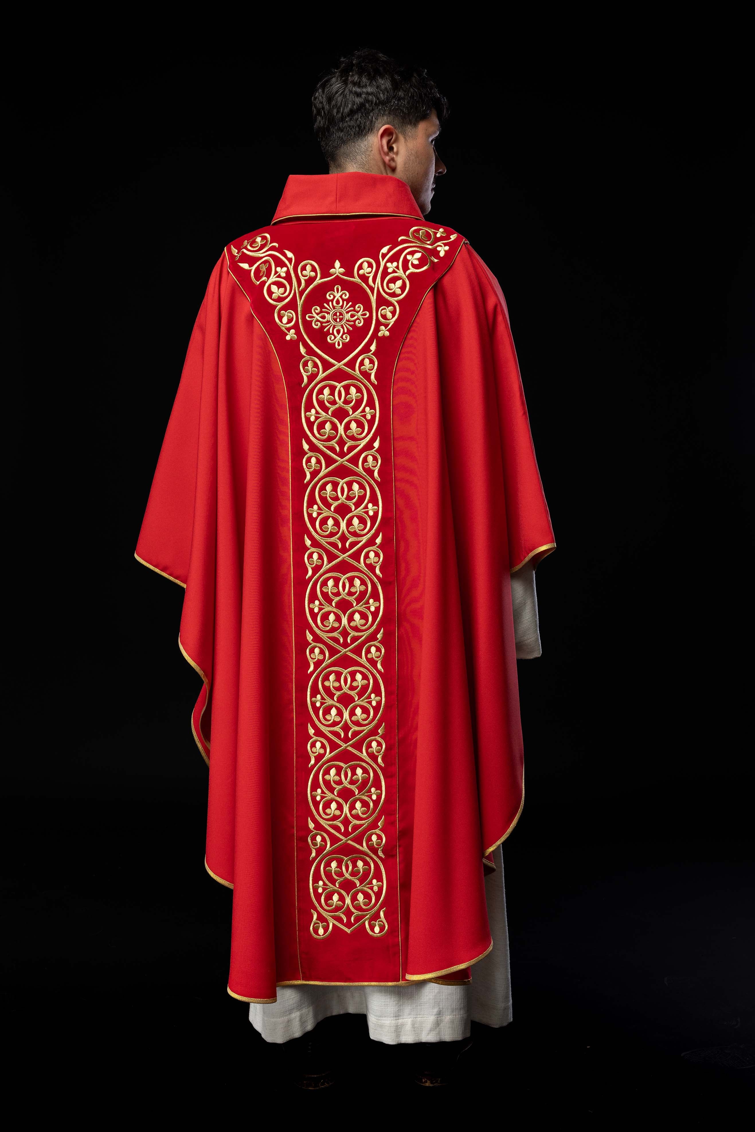 Red liturgical chasuble decorated with embroidery on velvet