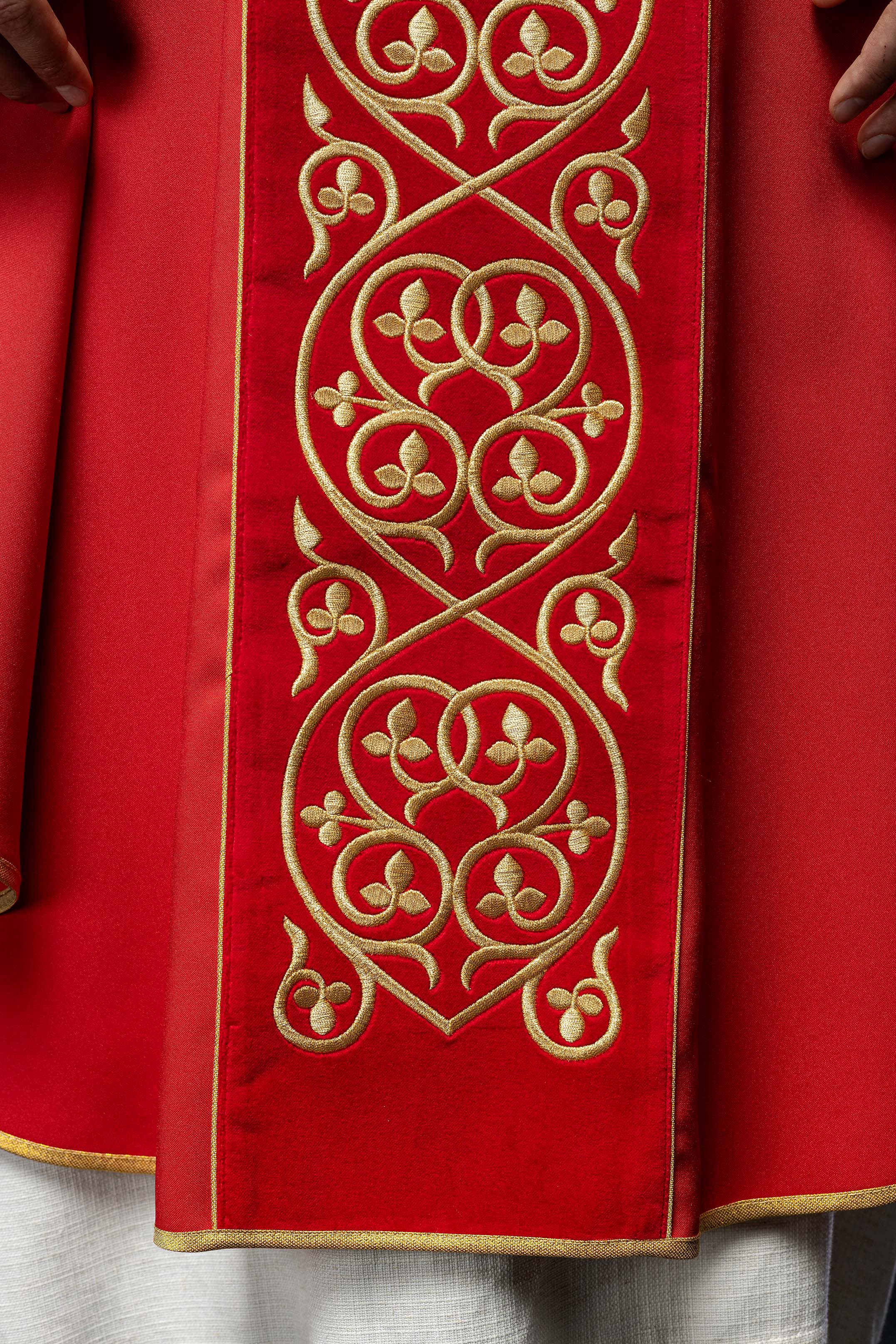 Red liturgical chasuble decorated with embroidery on velvet