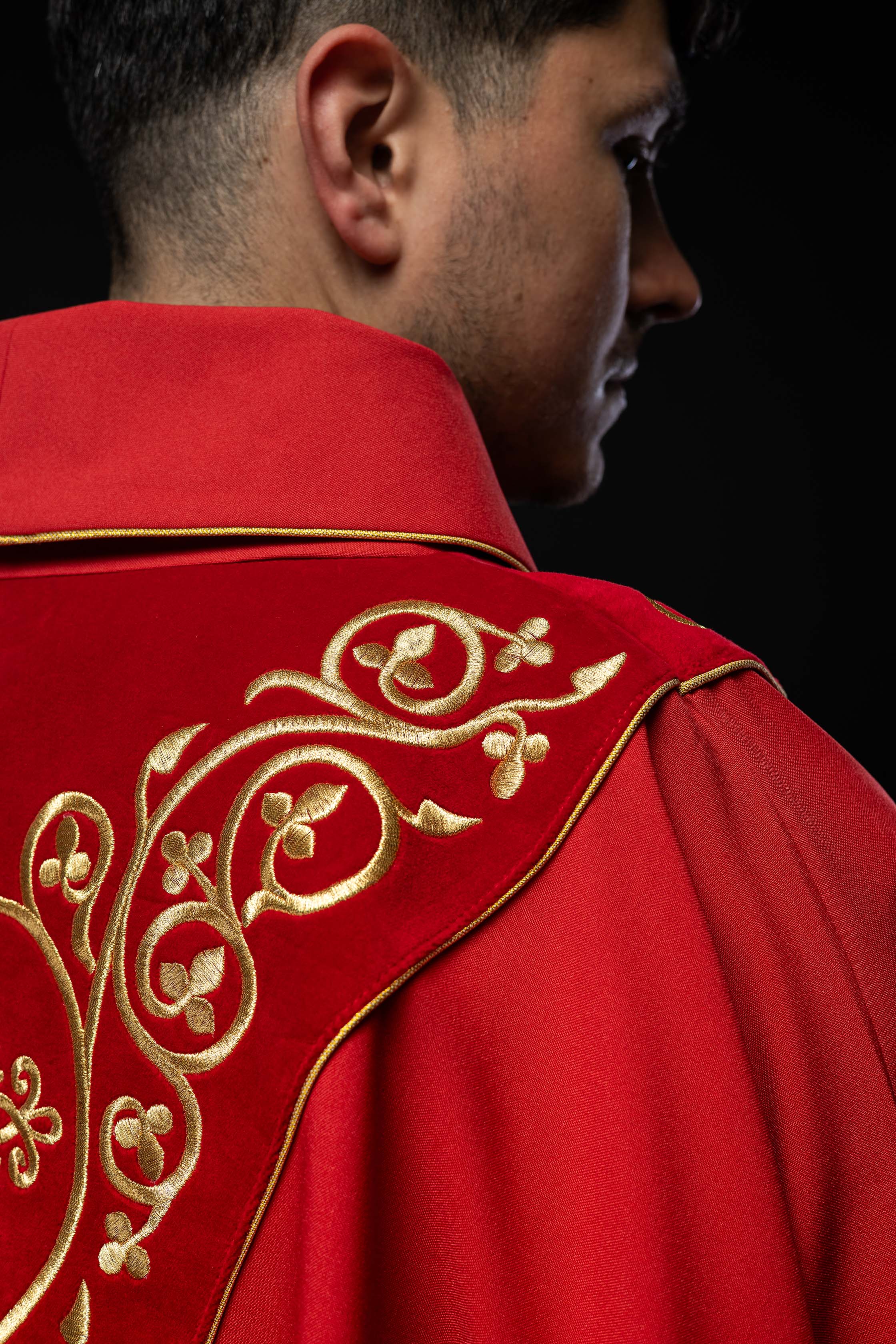 Red liturgical chasuble decorated with embroidery on velvet