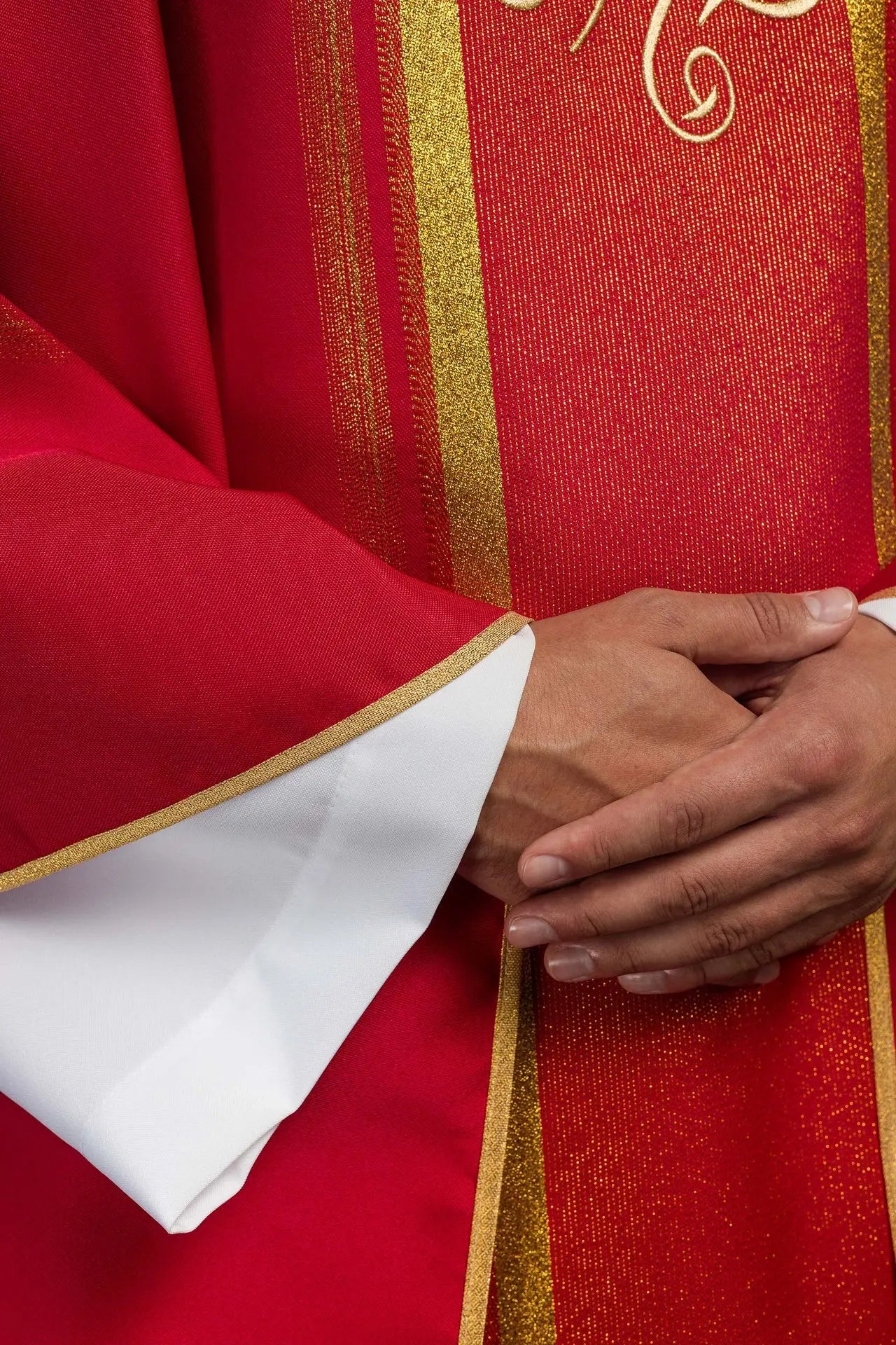 Red embroidered chasuble with IHS design with gilding