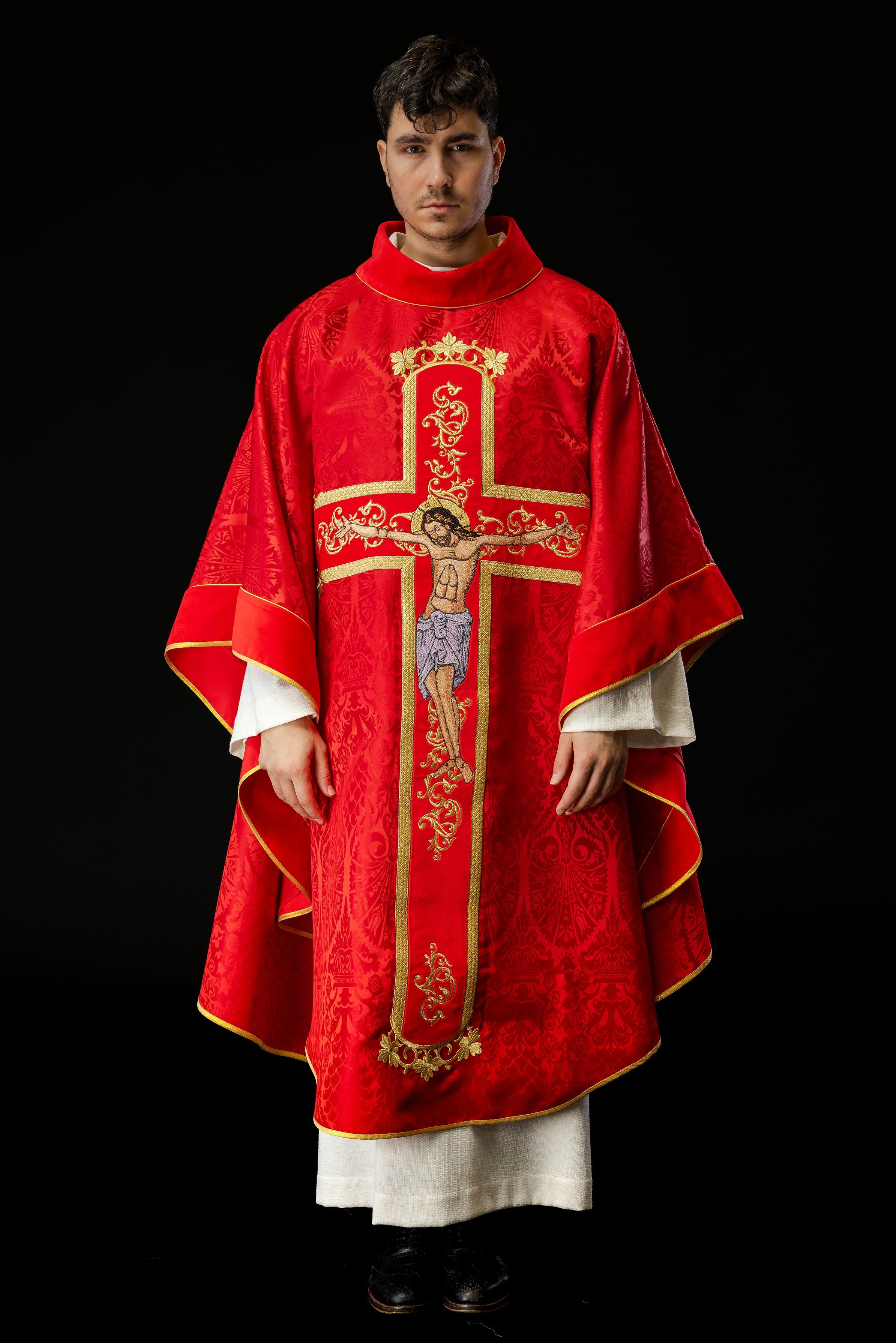 Red chasuble embroidered with the pattern of Jesus Christ