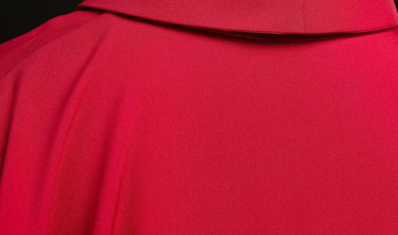 Embroidered red chasuble with JHS symbol