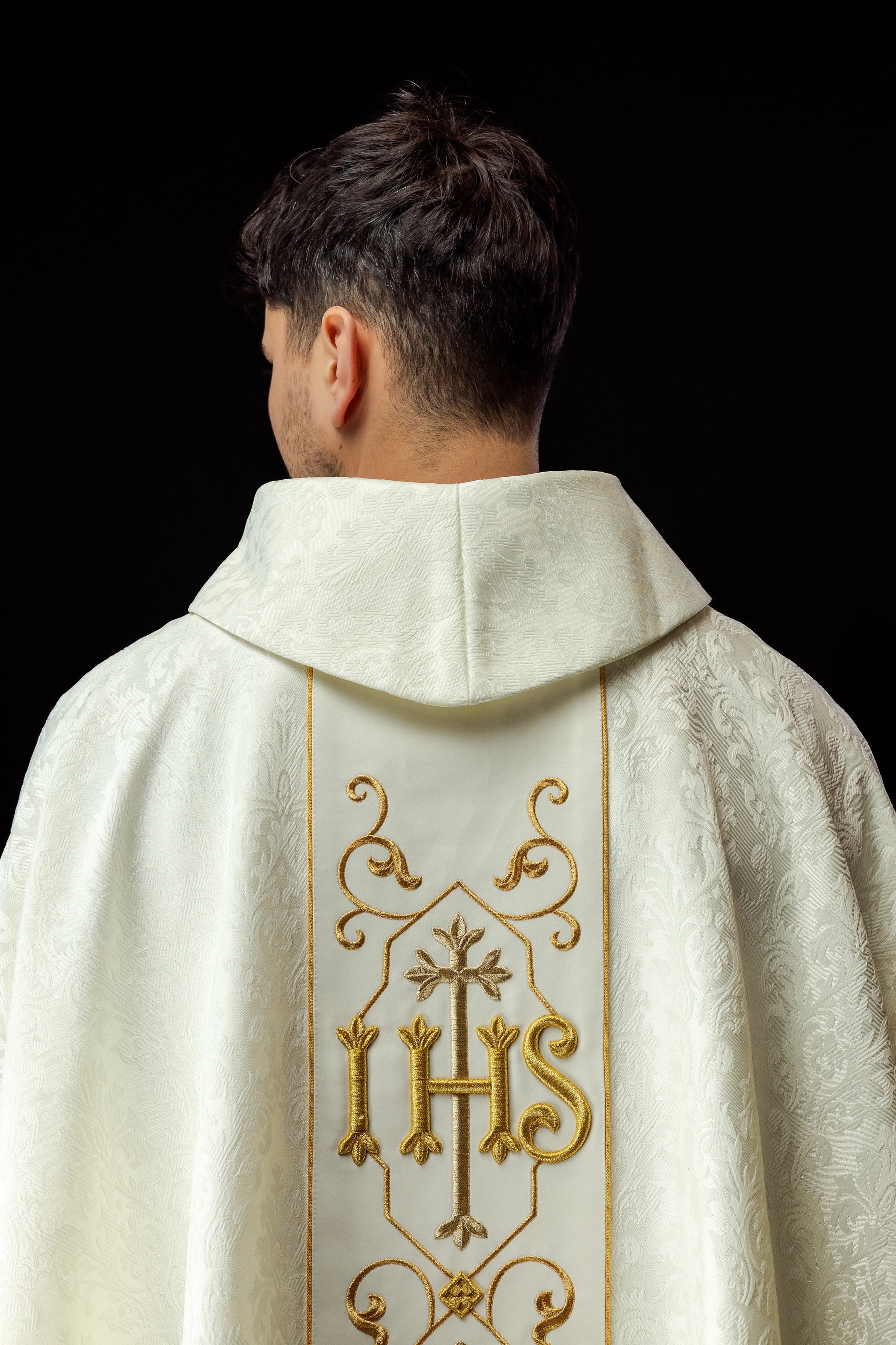 Ecru chasuble embroidered on decorative fabric with IHS symbol