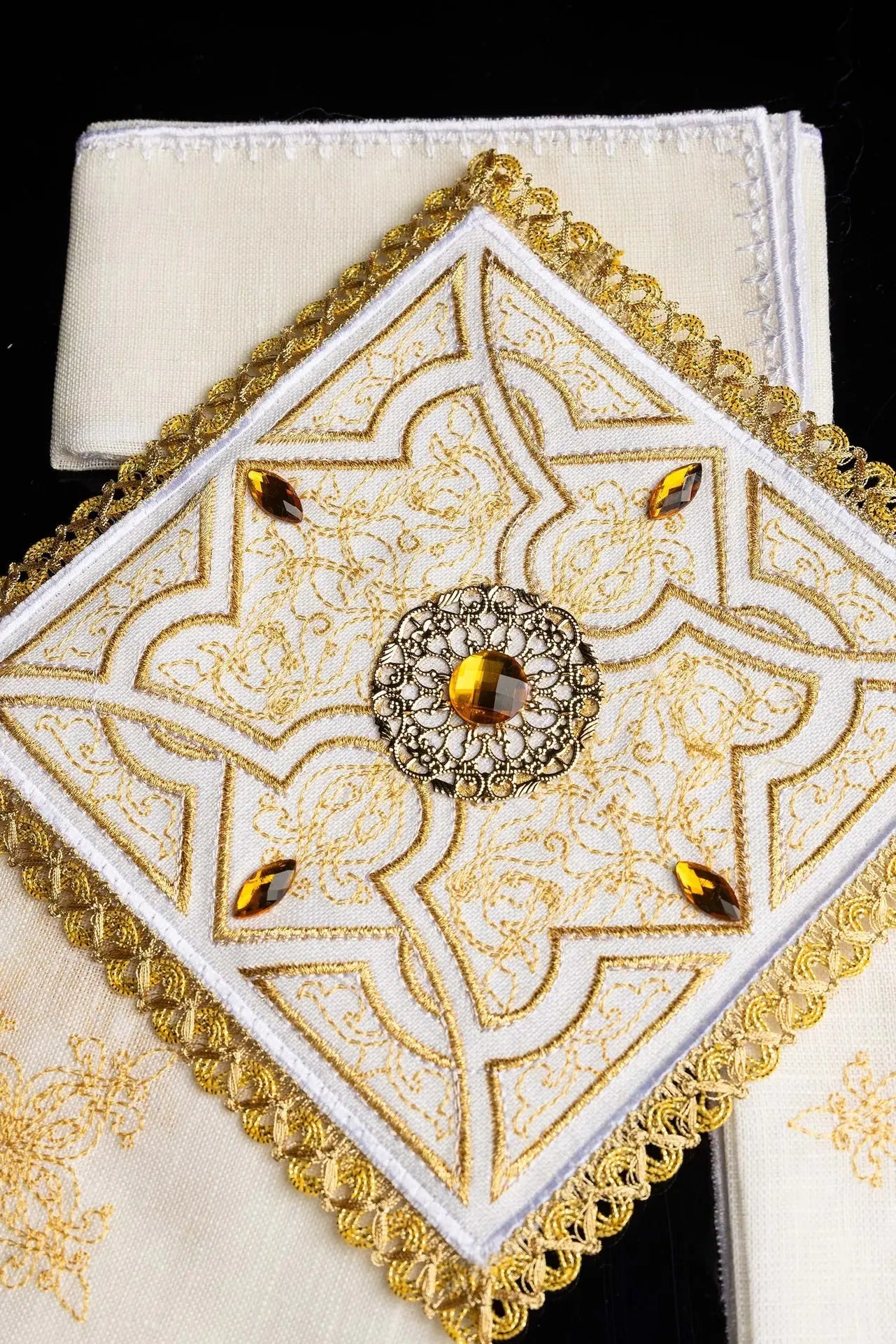 Richly decorated embroidered chalice linen