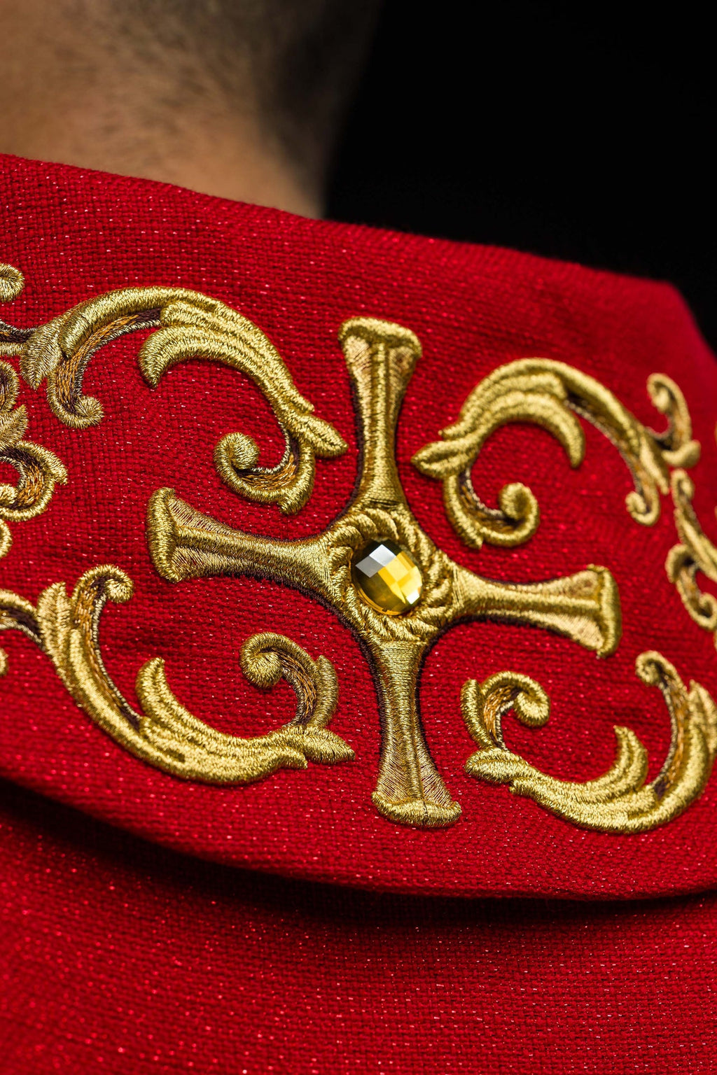 Red chasuble richly embroidered with stones