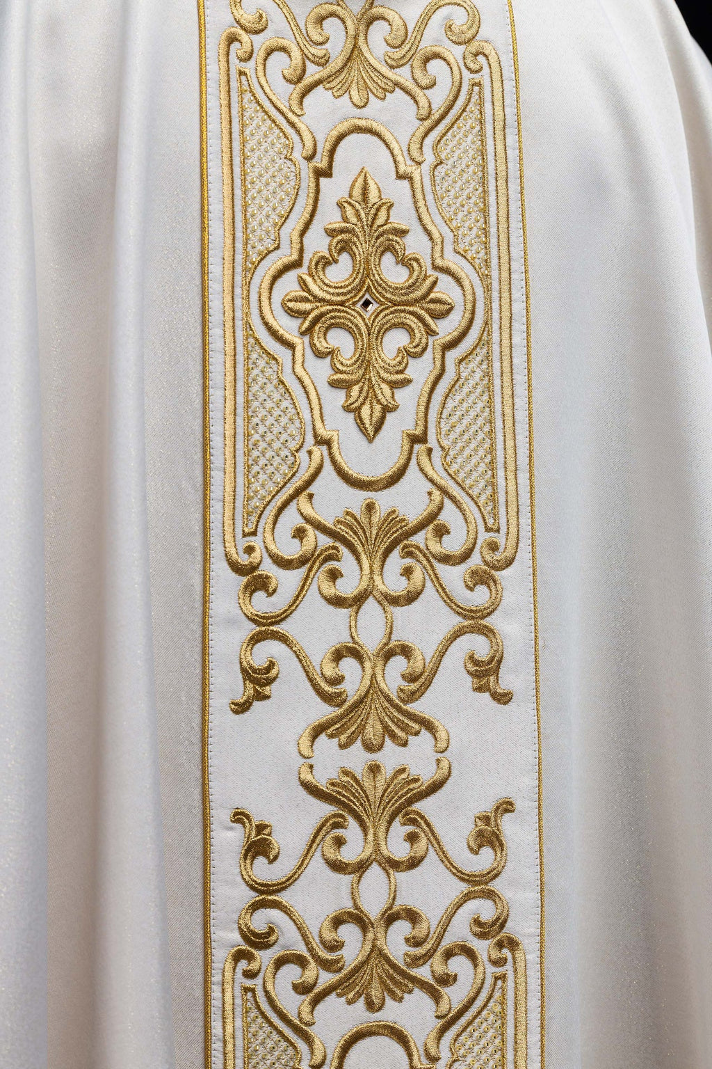 Shimmering fabric chasuble with rich gold embroidery on the belt