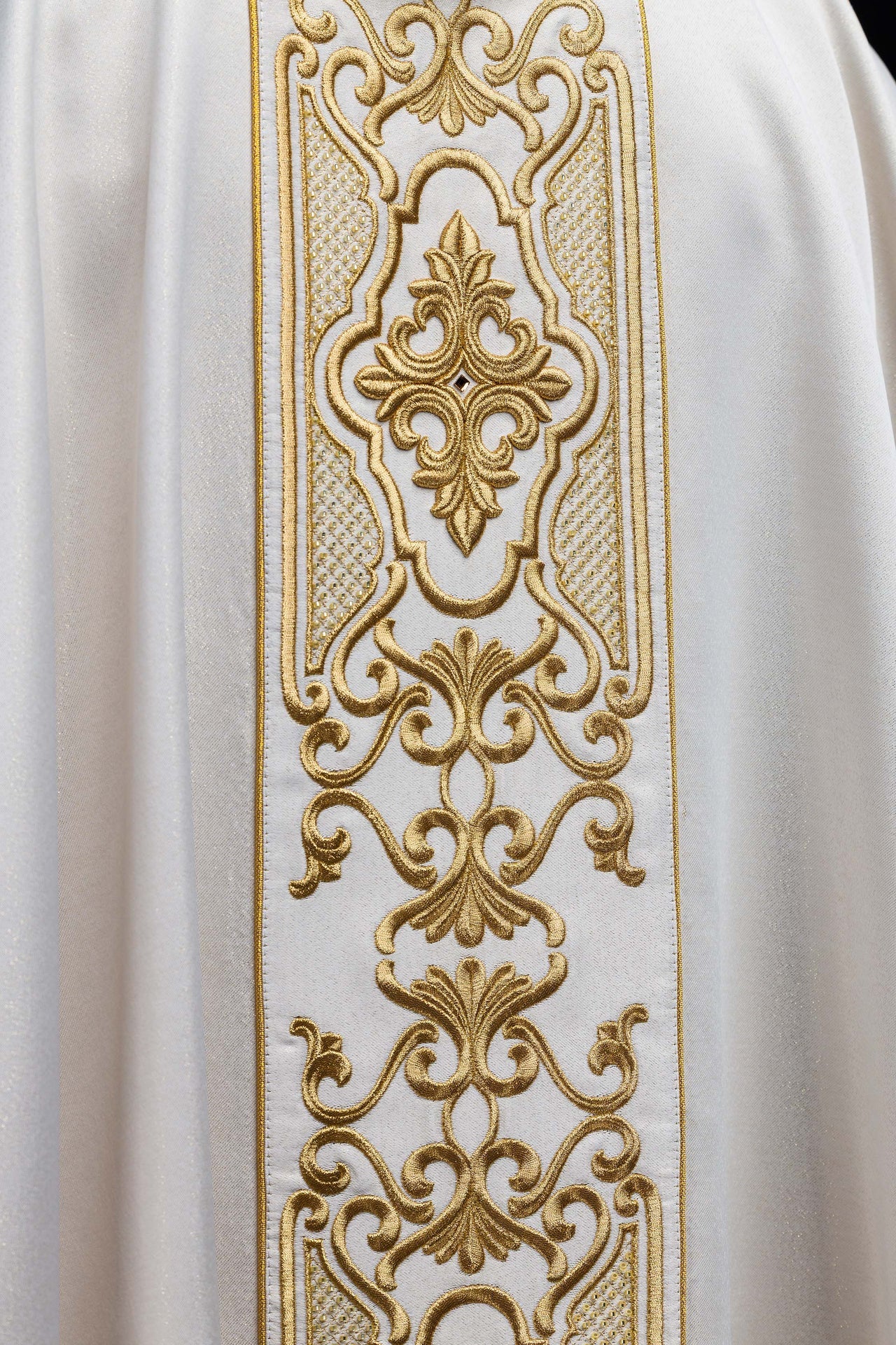 Shimmering fabric chasuble with rich gold embroidery on the belt