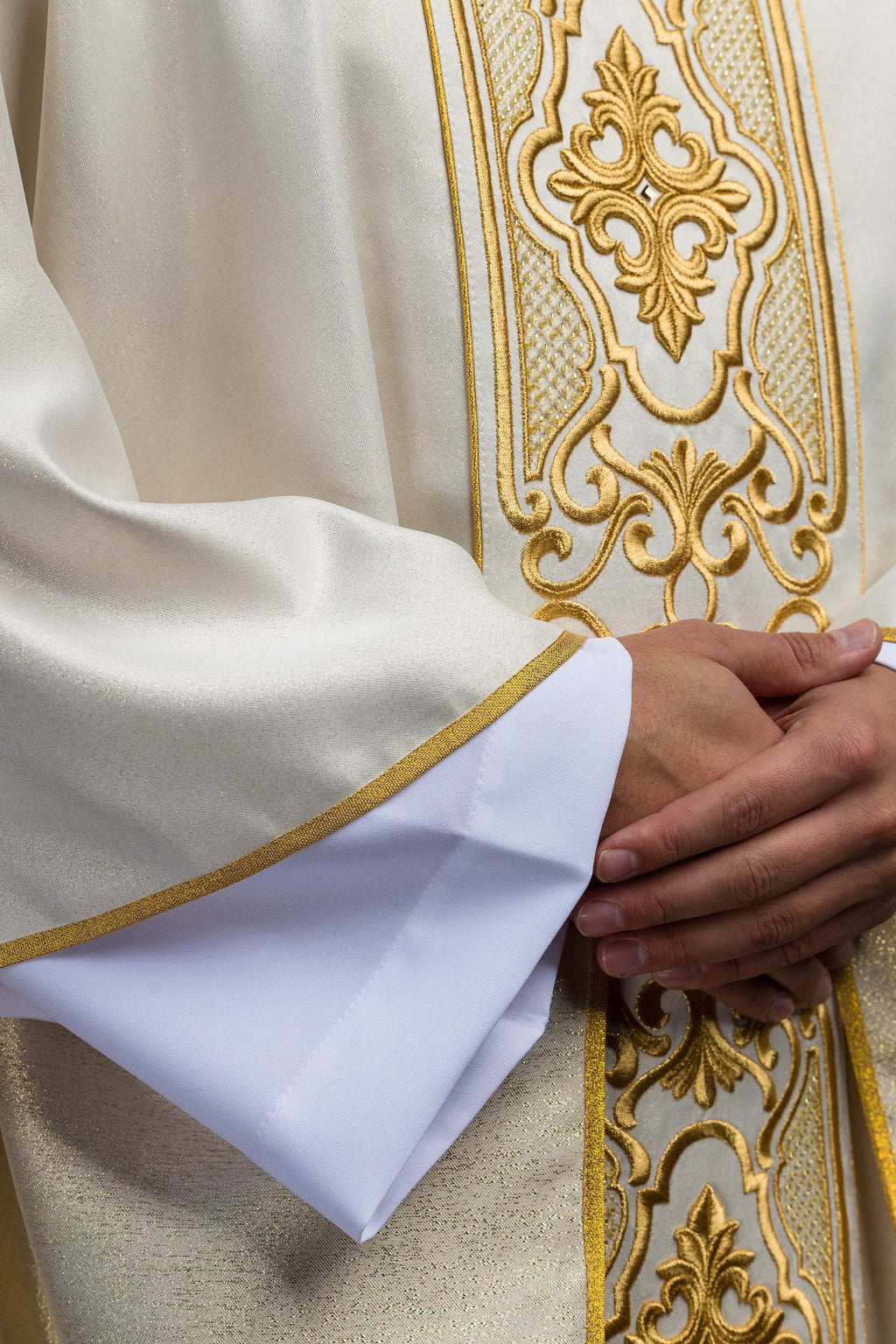 Shimmering fabric chasuble with rich gold embroidery on the belt