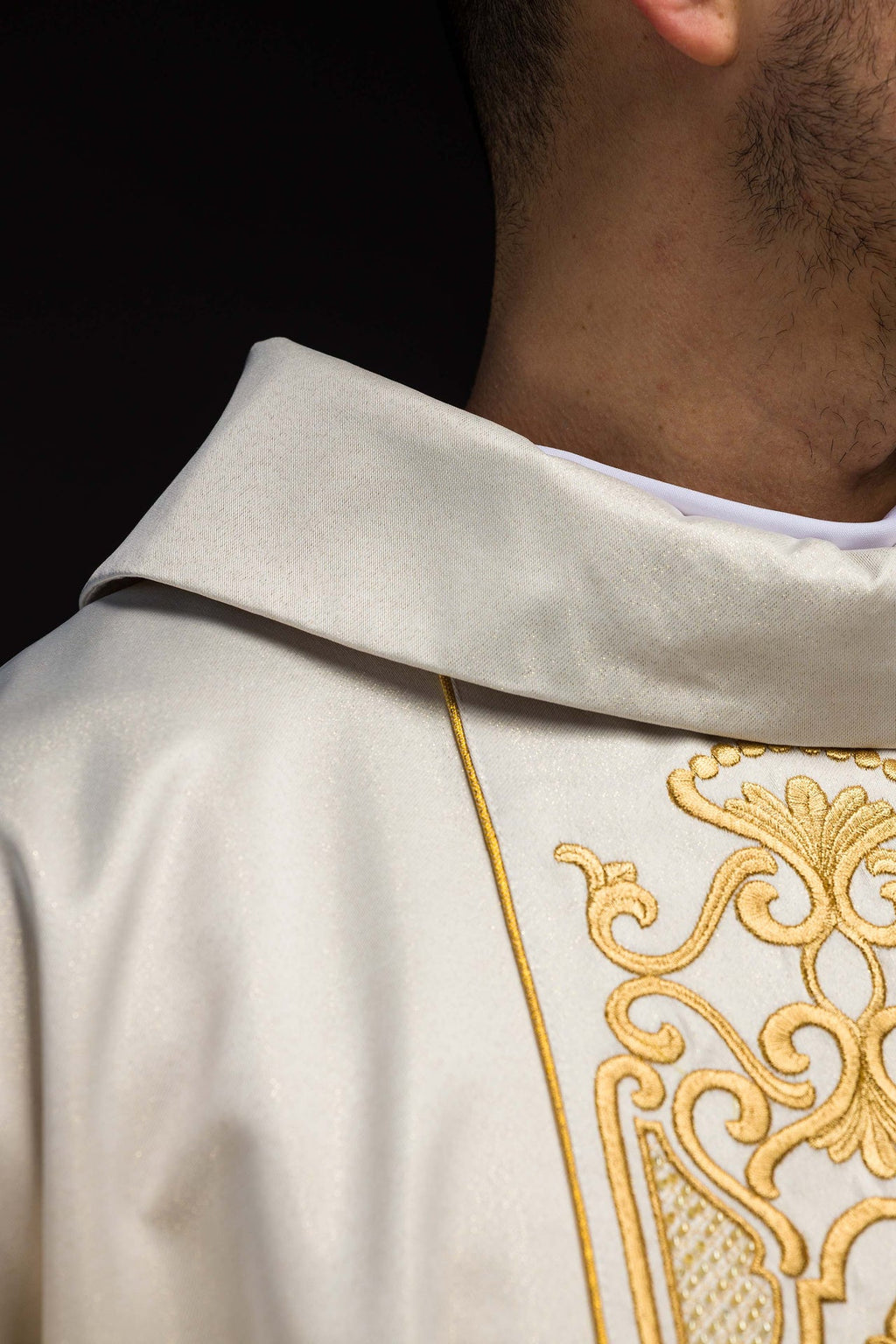 Shimmering fabric chasuble with rich gold embroidery on the belt