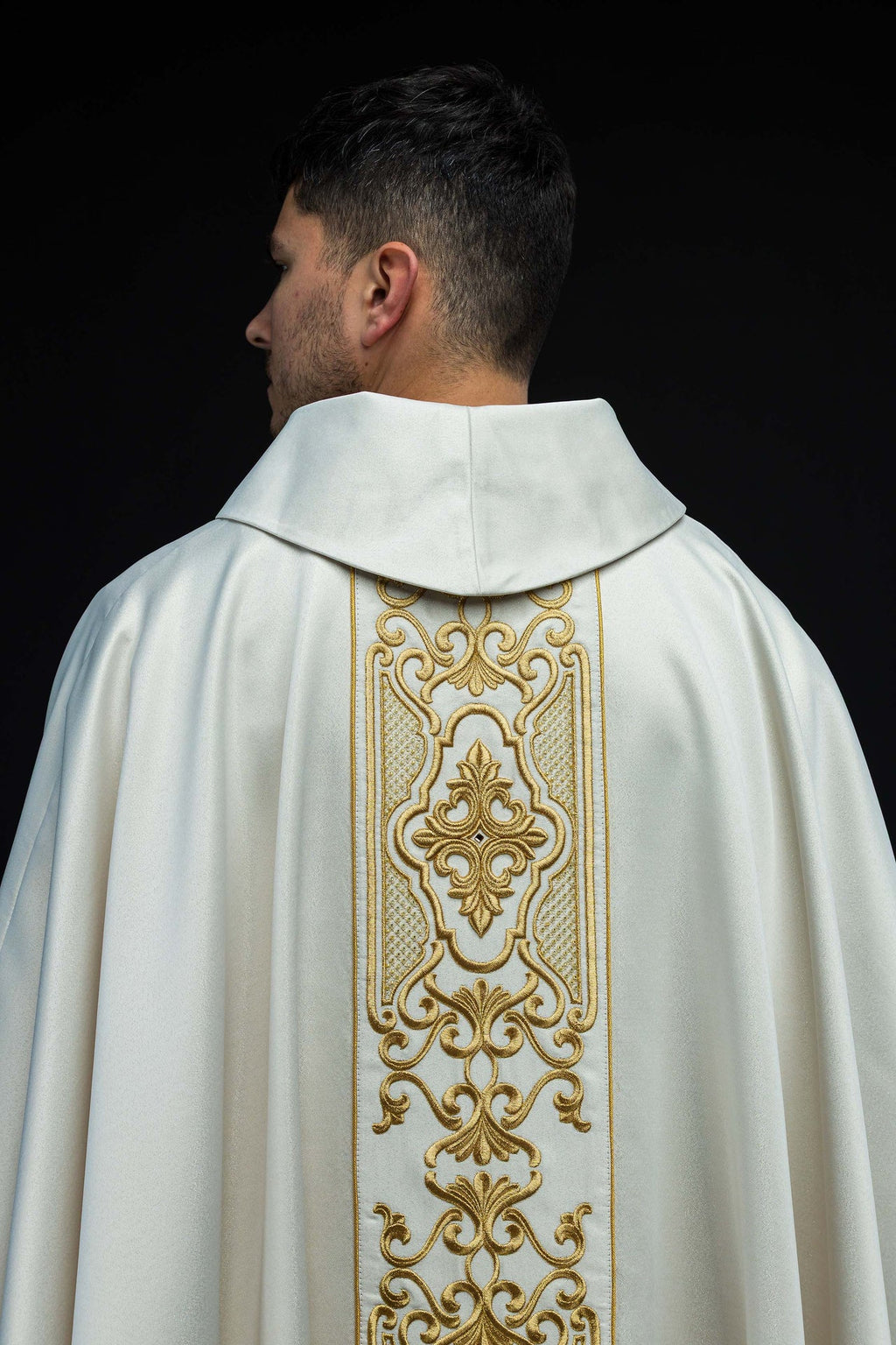 Shimmering fabric chasuble with rich gold embroidery on the belt
