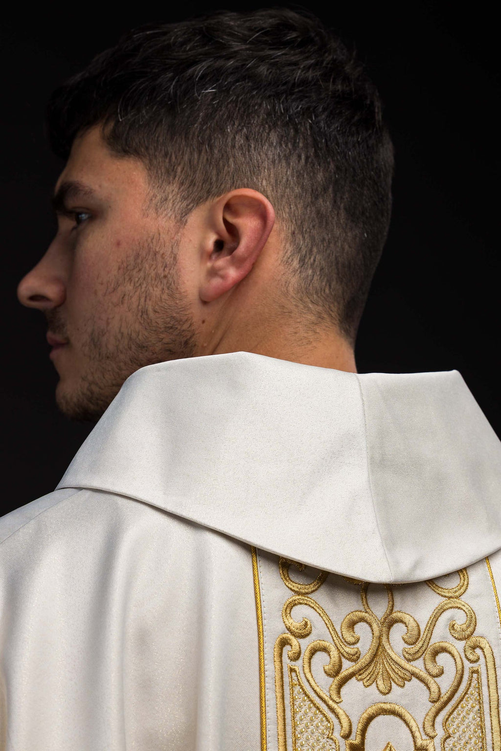 Shimmering fabric chasuble with rich gold embroidery on the belt