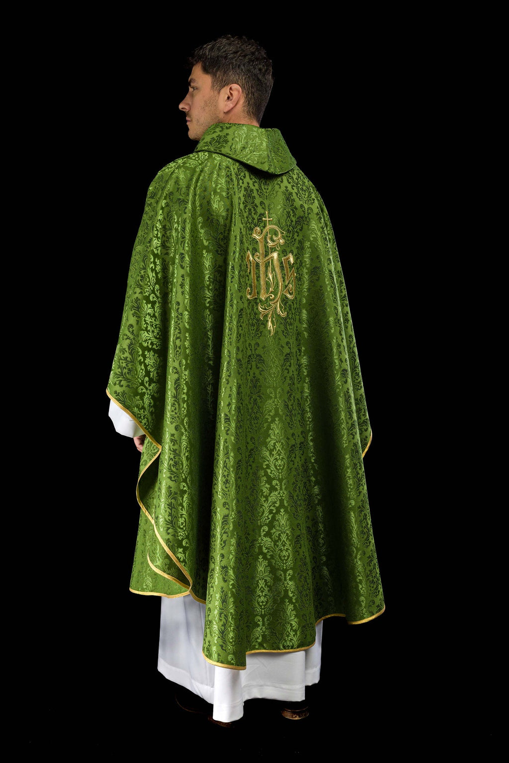 Green chasuble with embroidered IHS motif on decorative fabric