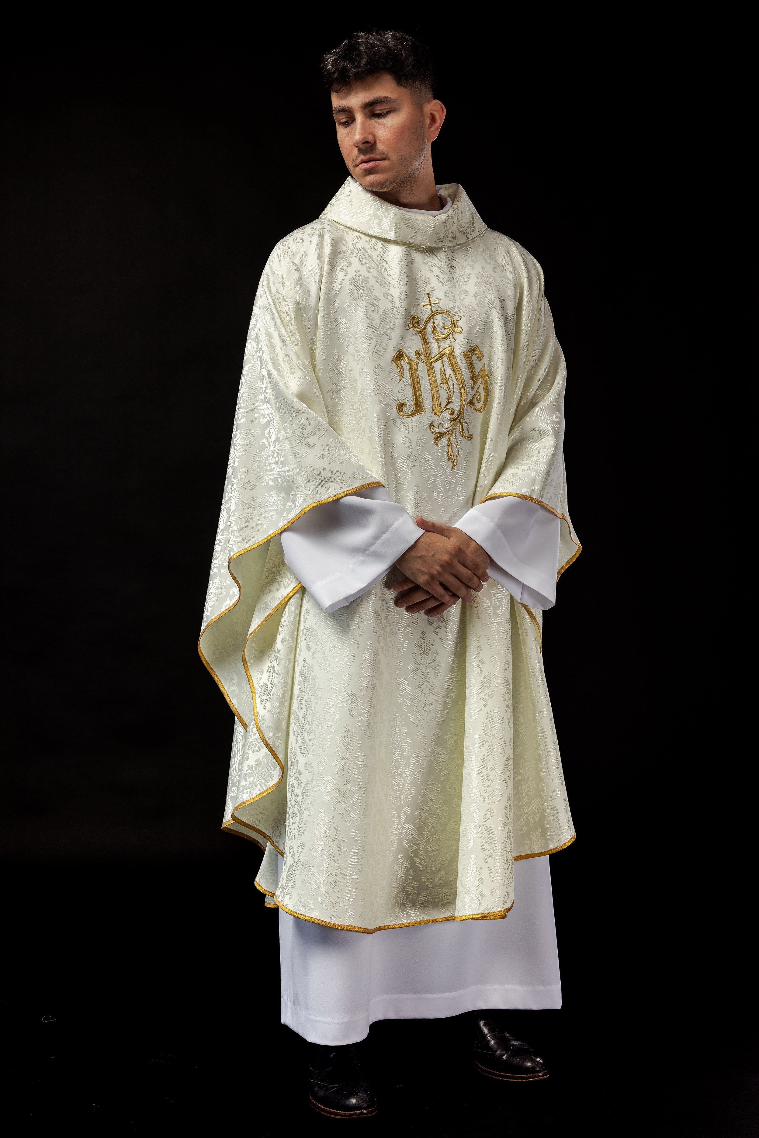 Ecru chasuble with embroidered IHS motif on decorative fabric