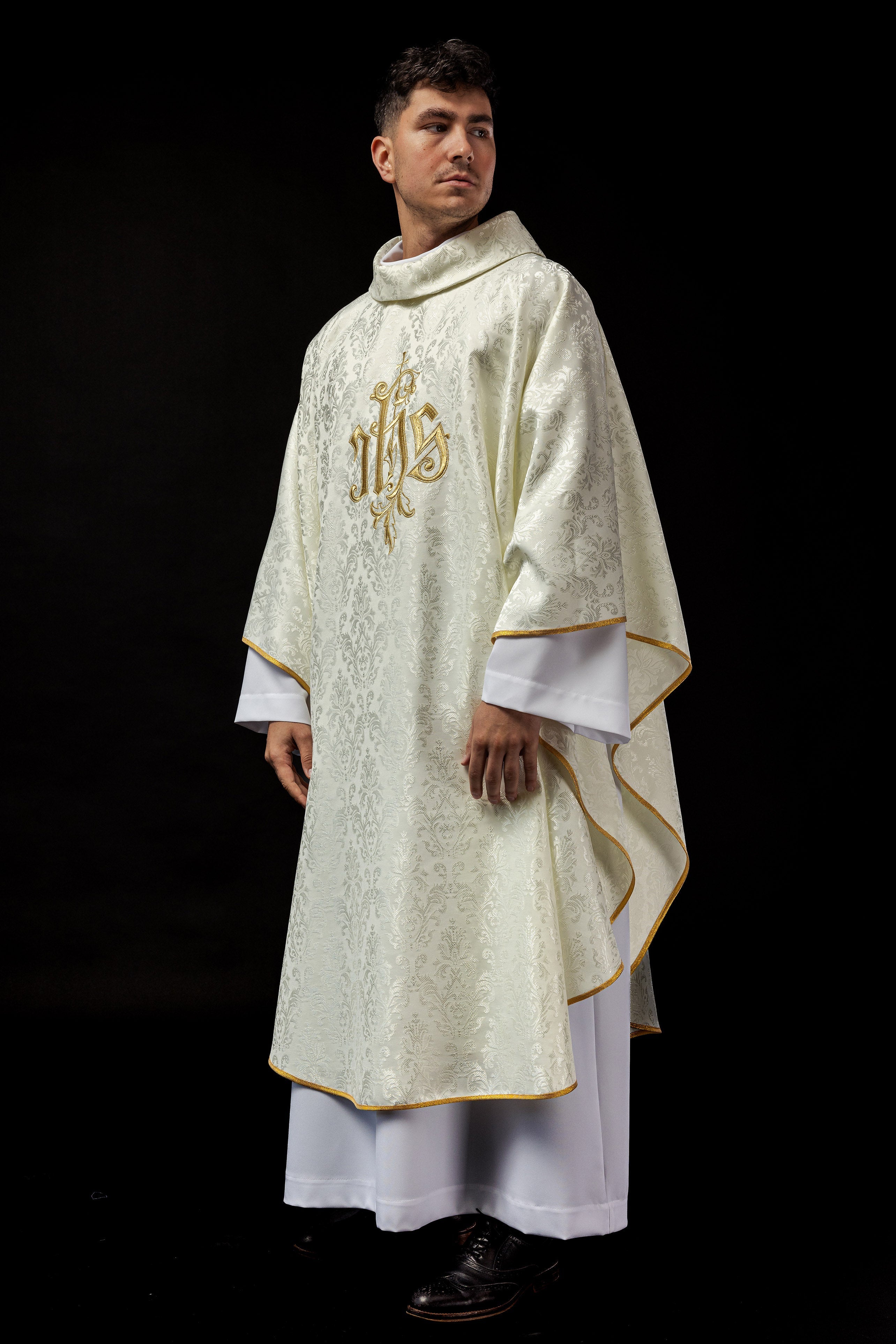 Ecru chasuble with embroidered IHS motif on decorative fabric