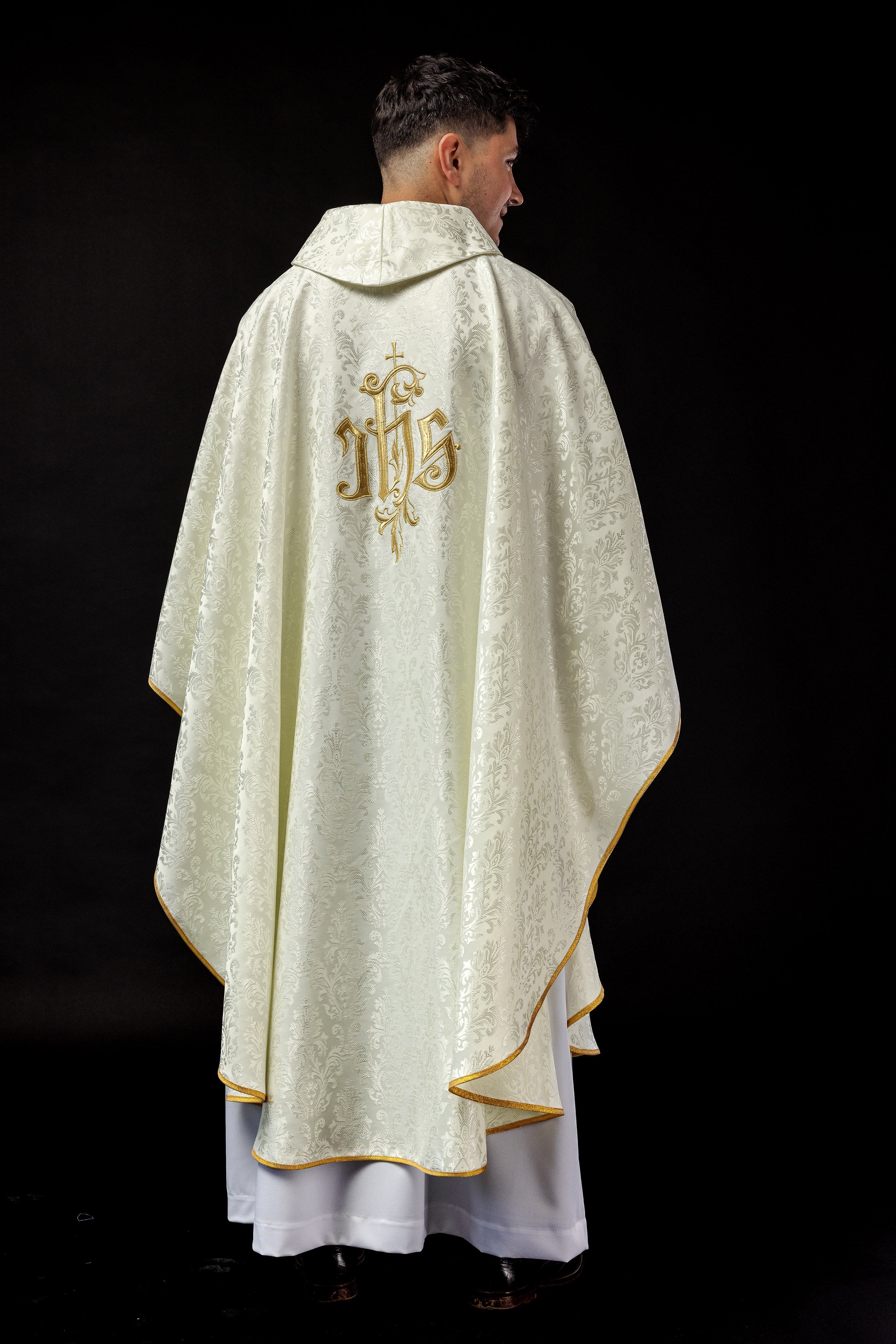 Ecru chasuble with embroidered IHS motif on decorative fabric