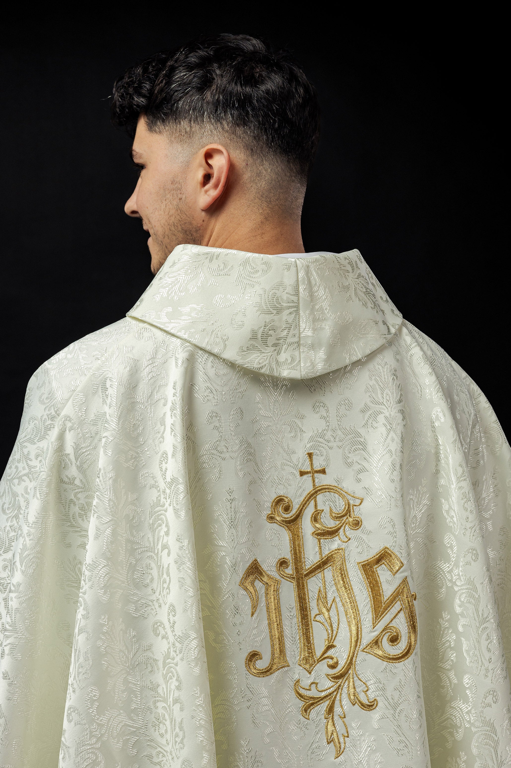 Ecru chasuble with embroidered IHS motif on decorative fabric