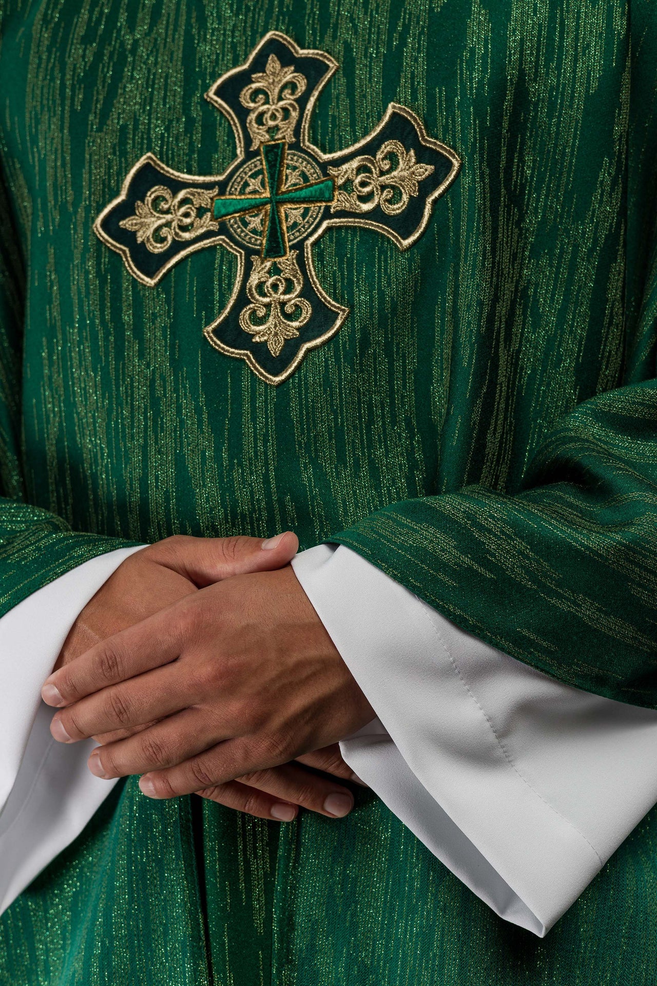 Green chasuble with richly embroidered cross and decorated collar