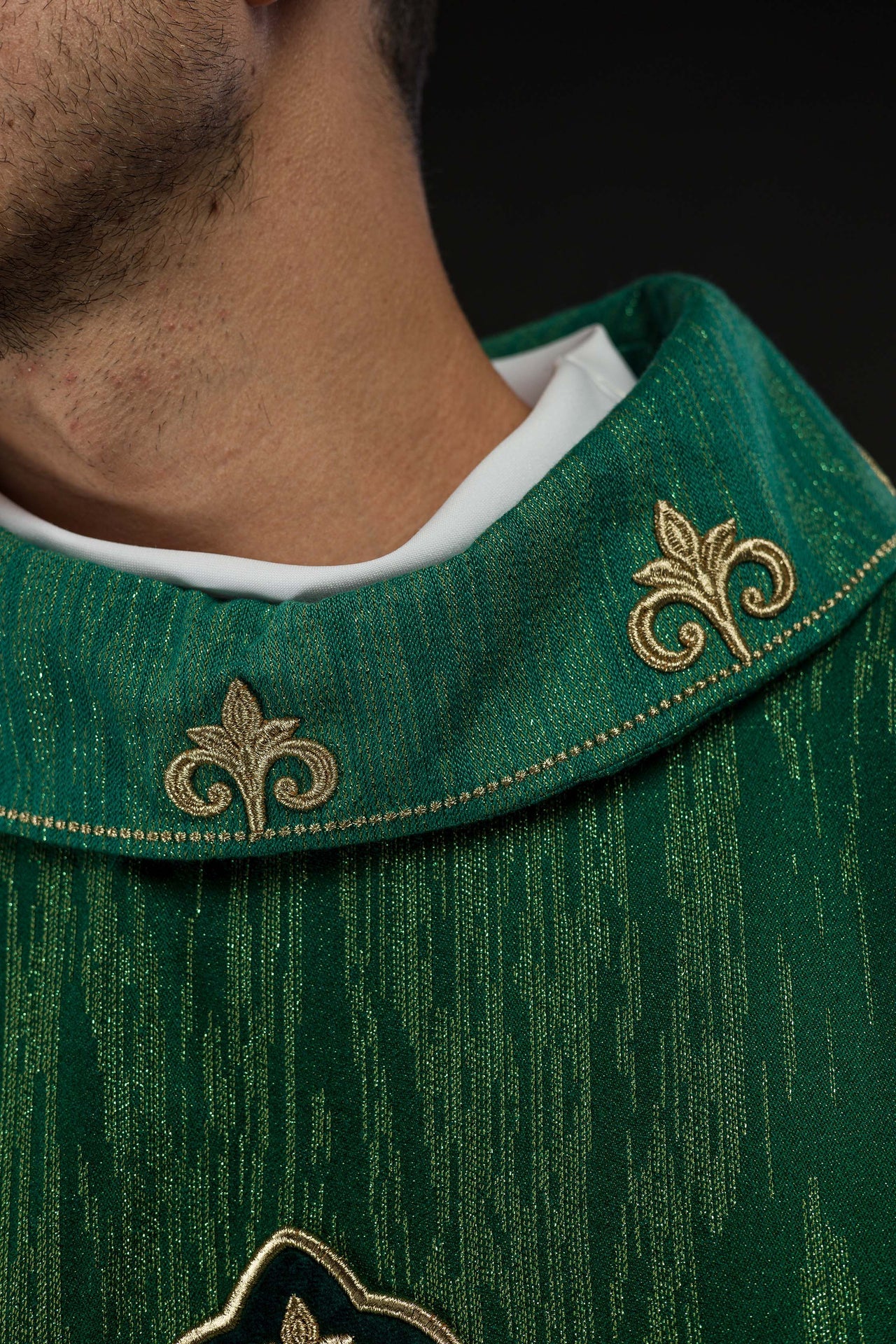 Green chasuble with richly embroidered cross and decorated collar