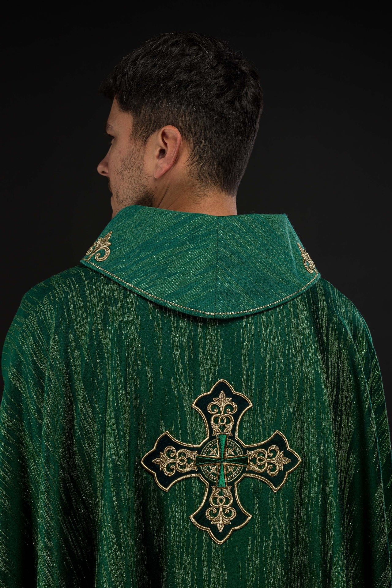 Green chasuble with richly embroidered cross and decorated collar