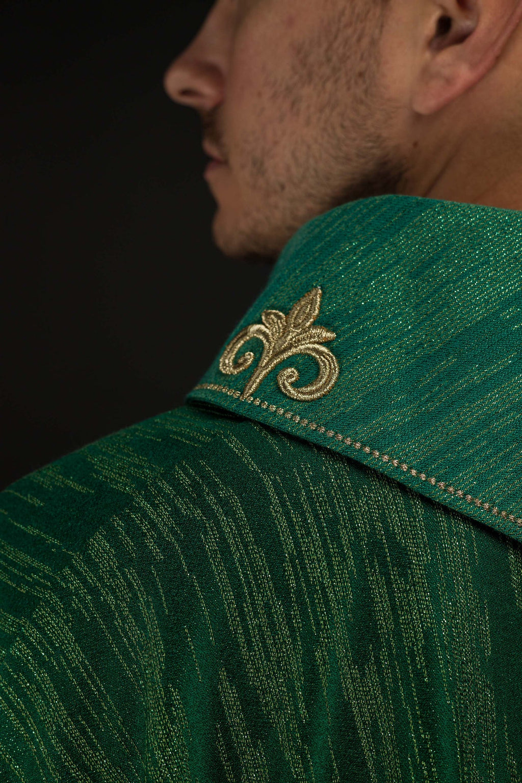 Green chasuble with richly embroidered cross and decorated collar