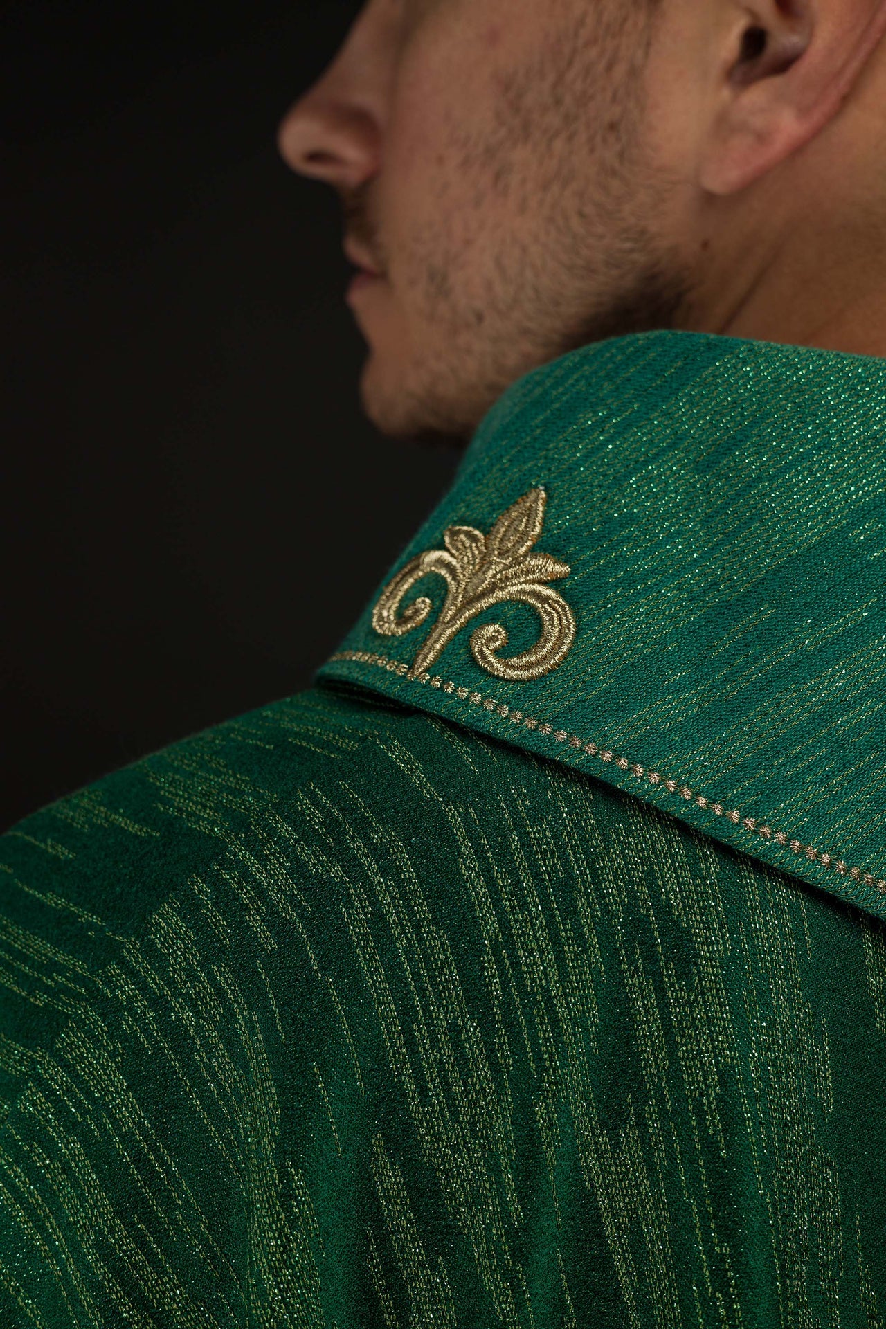 Green chasuble with richly embroidered cross and decorated collar