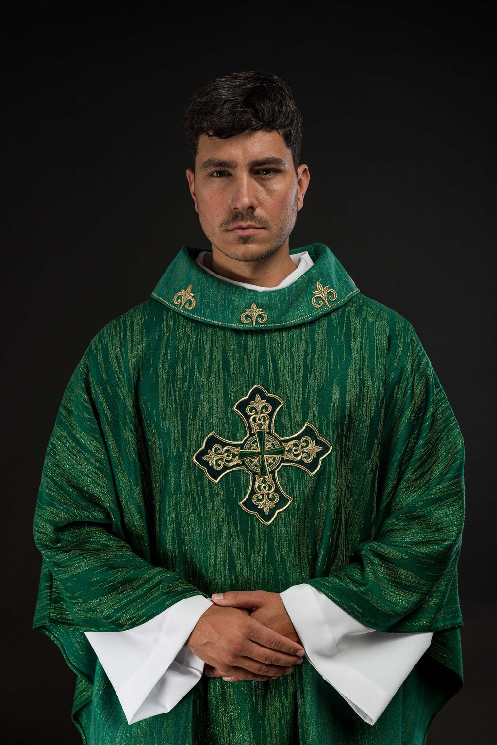 Green chasuble with richly embroidered cross and decorated collar