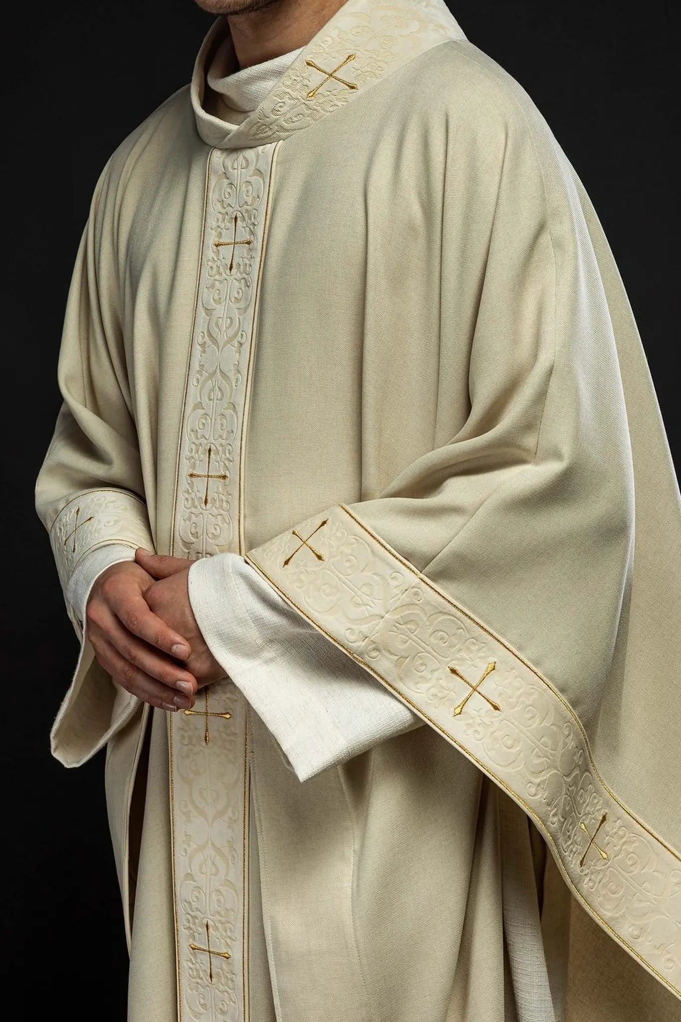 Chasuble in ecru color with an embroidered band and collar decorated with crosses