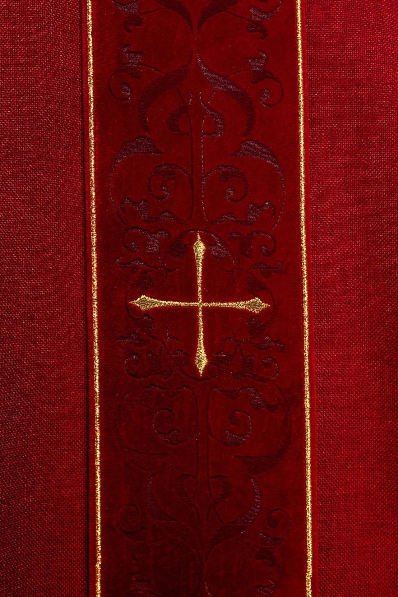 Red chasuble with an embroidered band of crosses