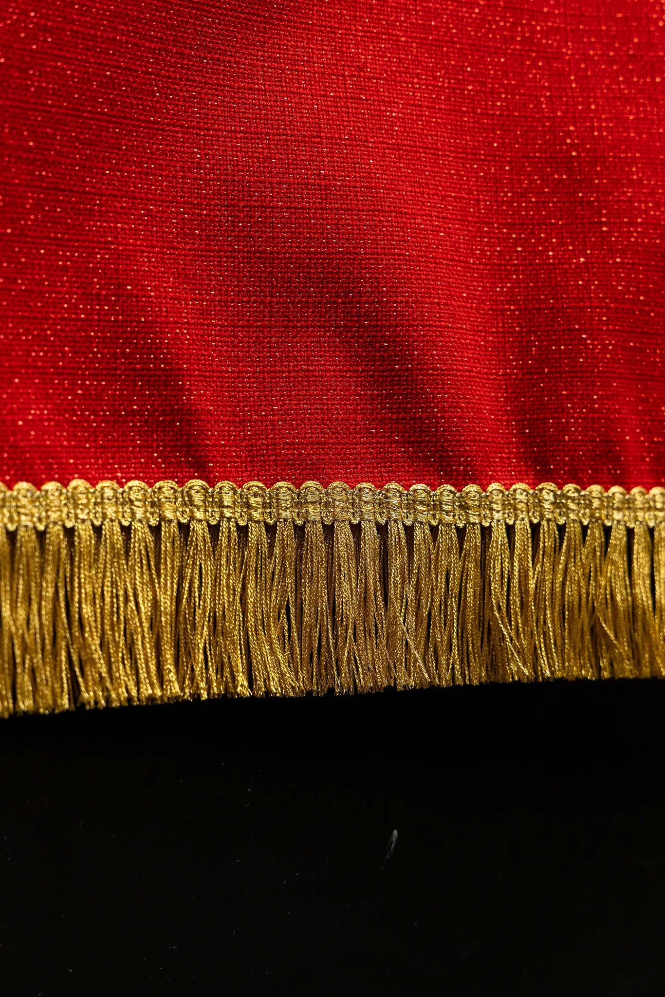 Red lectern hanging with embroidered Dove of the Holy Spirit and rays, finished with gold fringes.