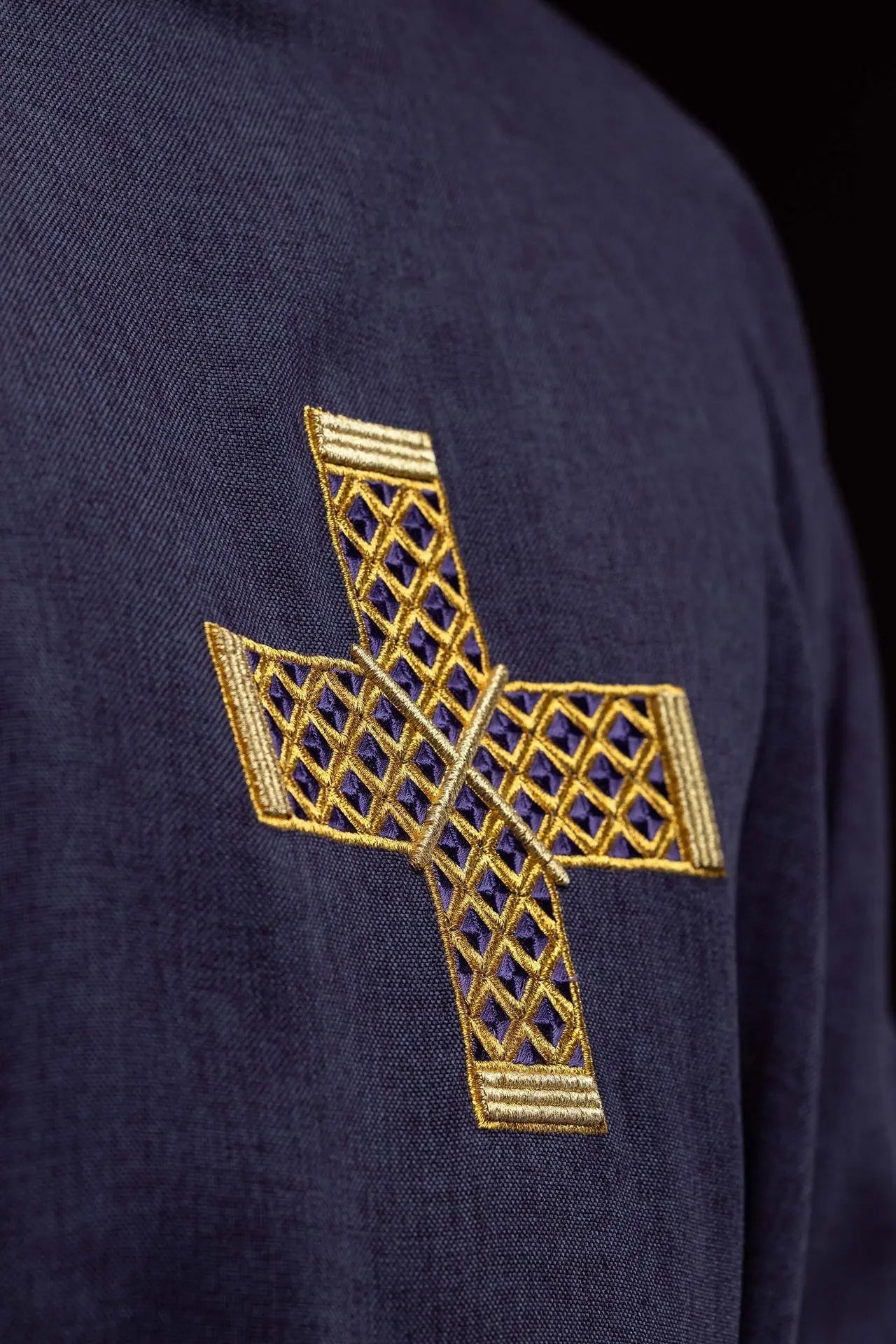 Purple dalmatic with embroidered crosses and collar