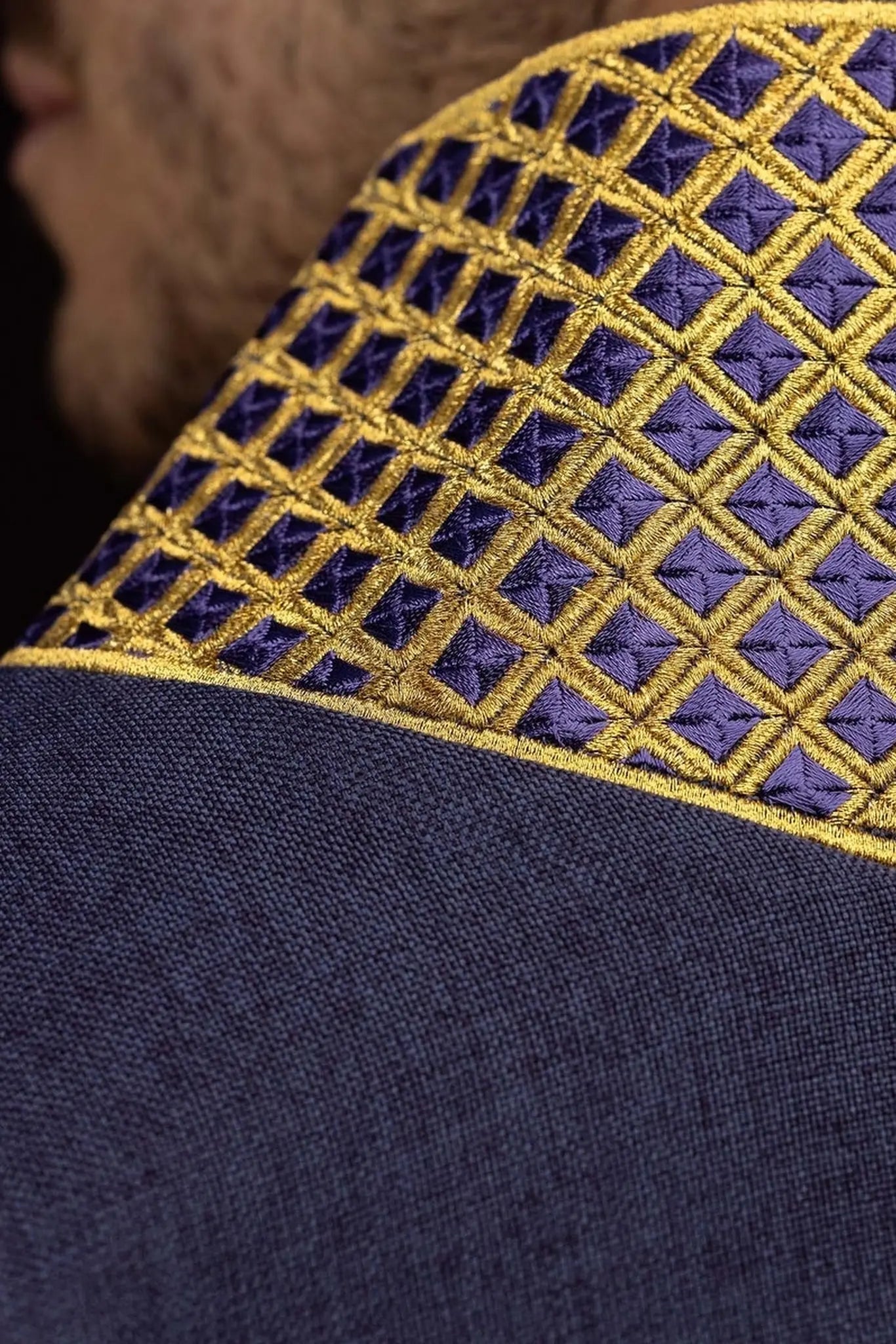 Purple dalmatic with embroidered crosses and collar