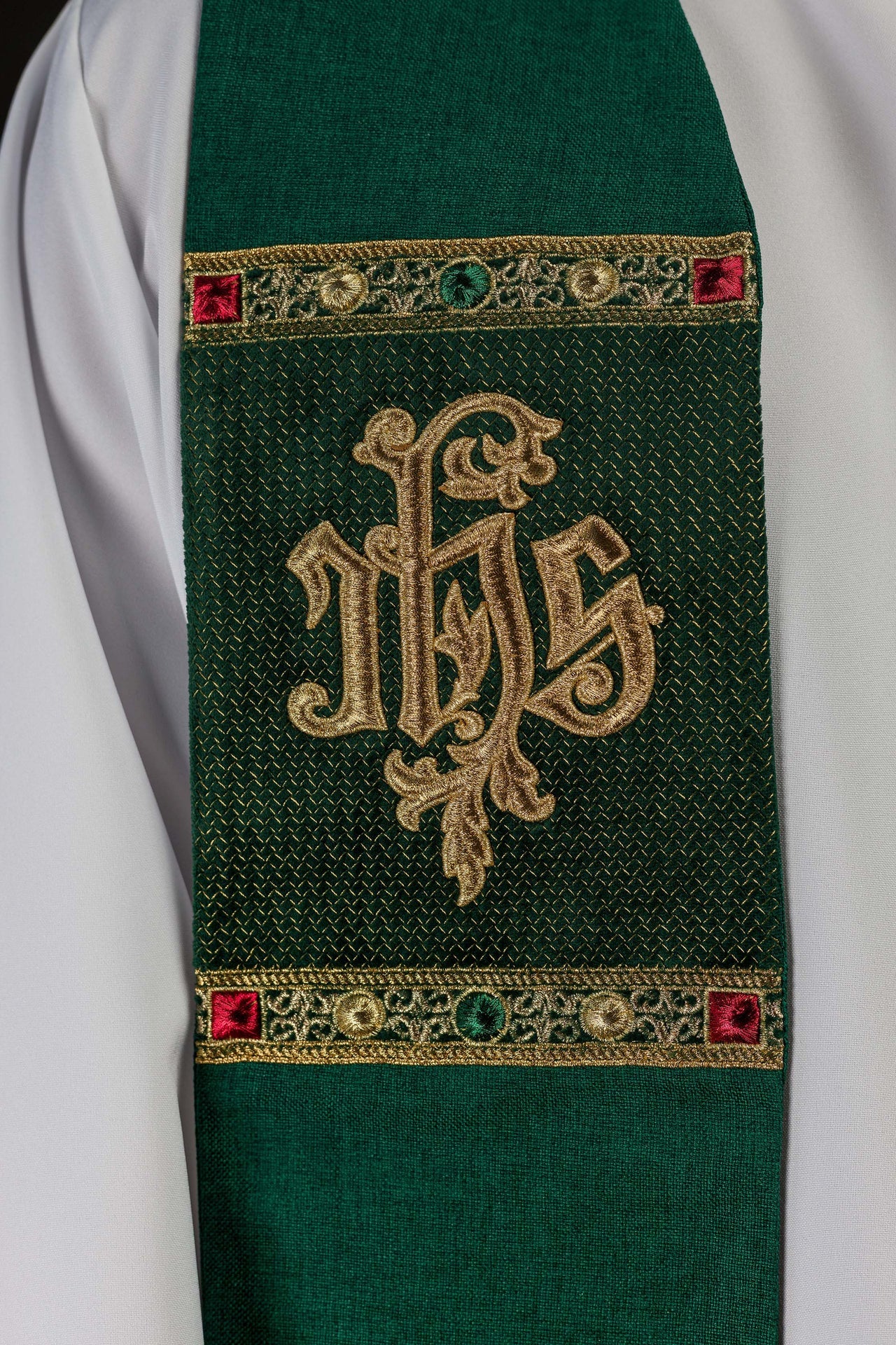 Green stole embroidered with the IHS motif
