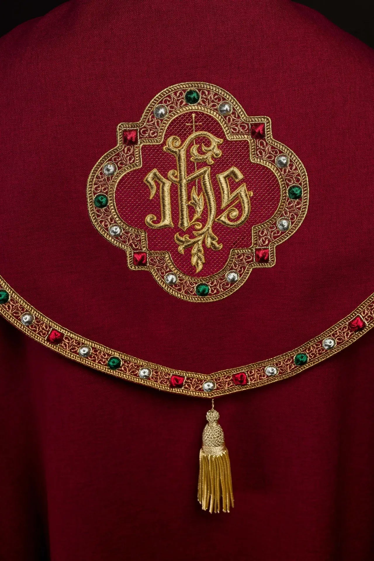 Red liturgical cape with gold IHS