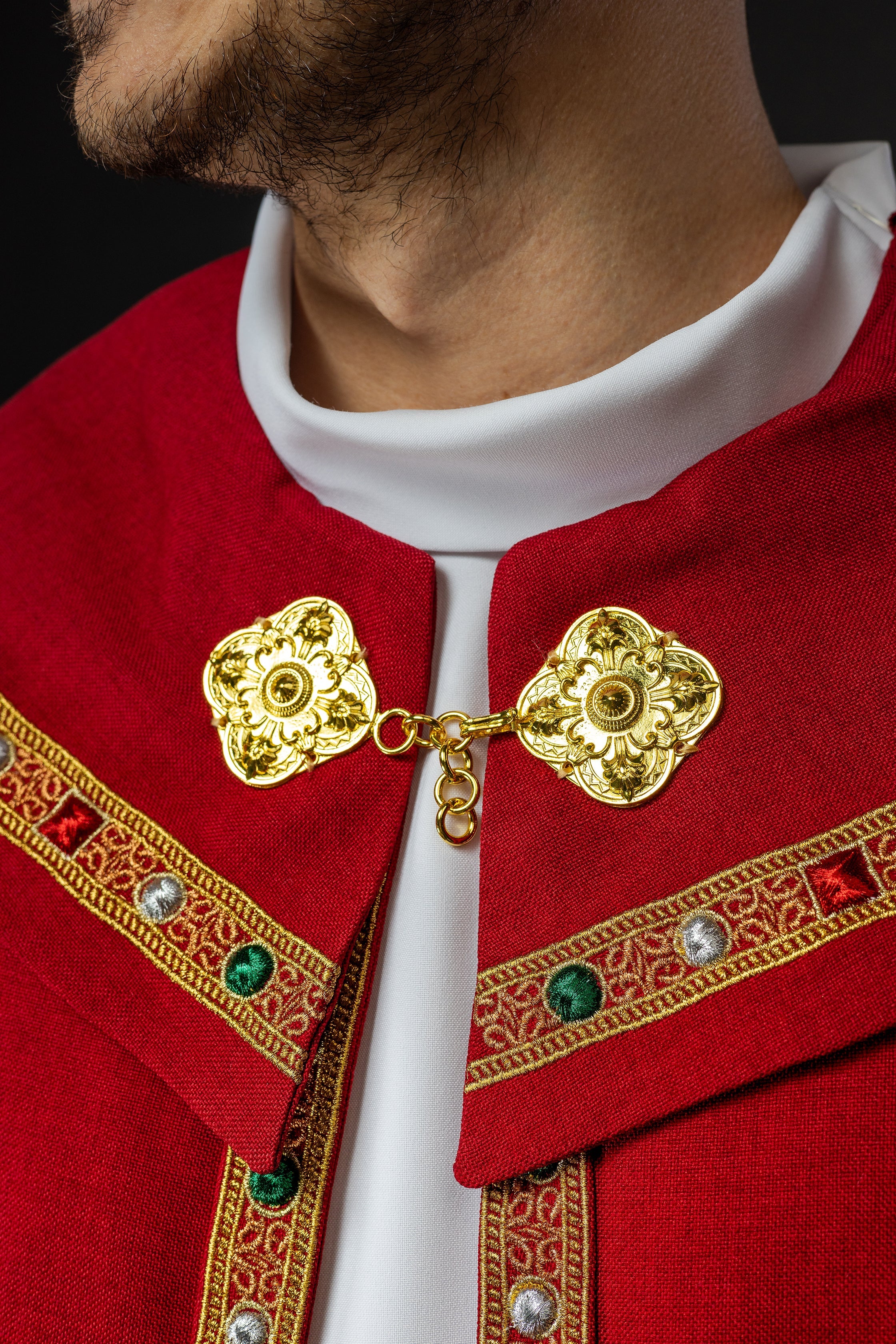 Red liturgical cape with gold IHS