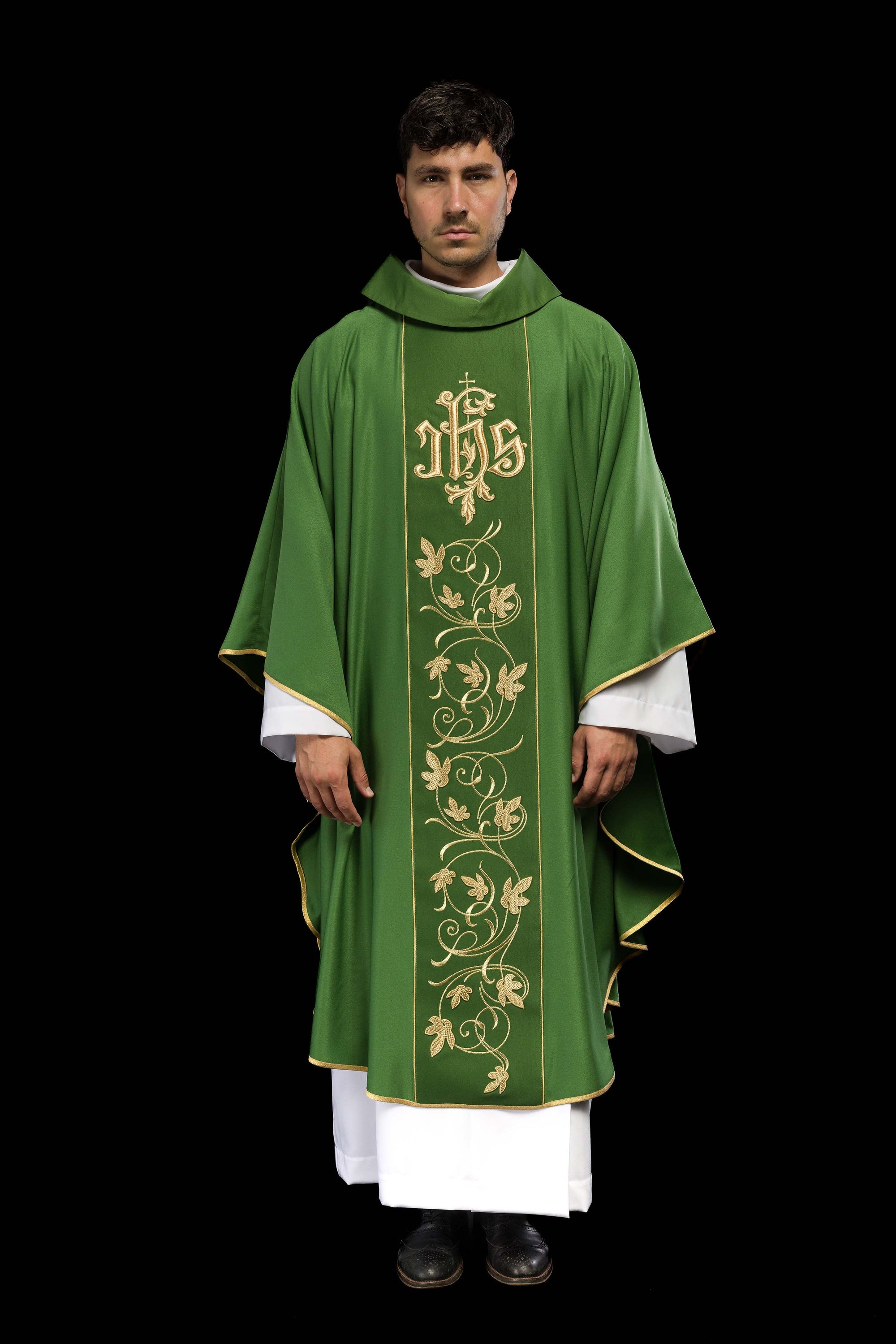 Green liturgical chasuble with richly decorated belt with floral motif and IHS