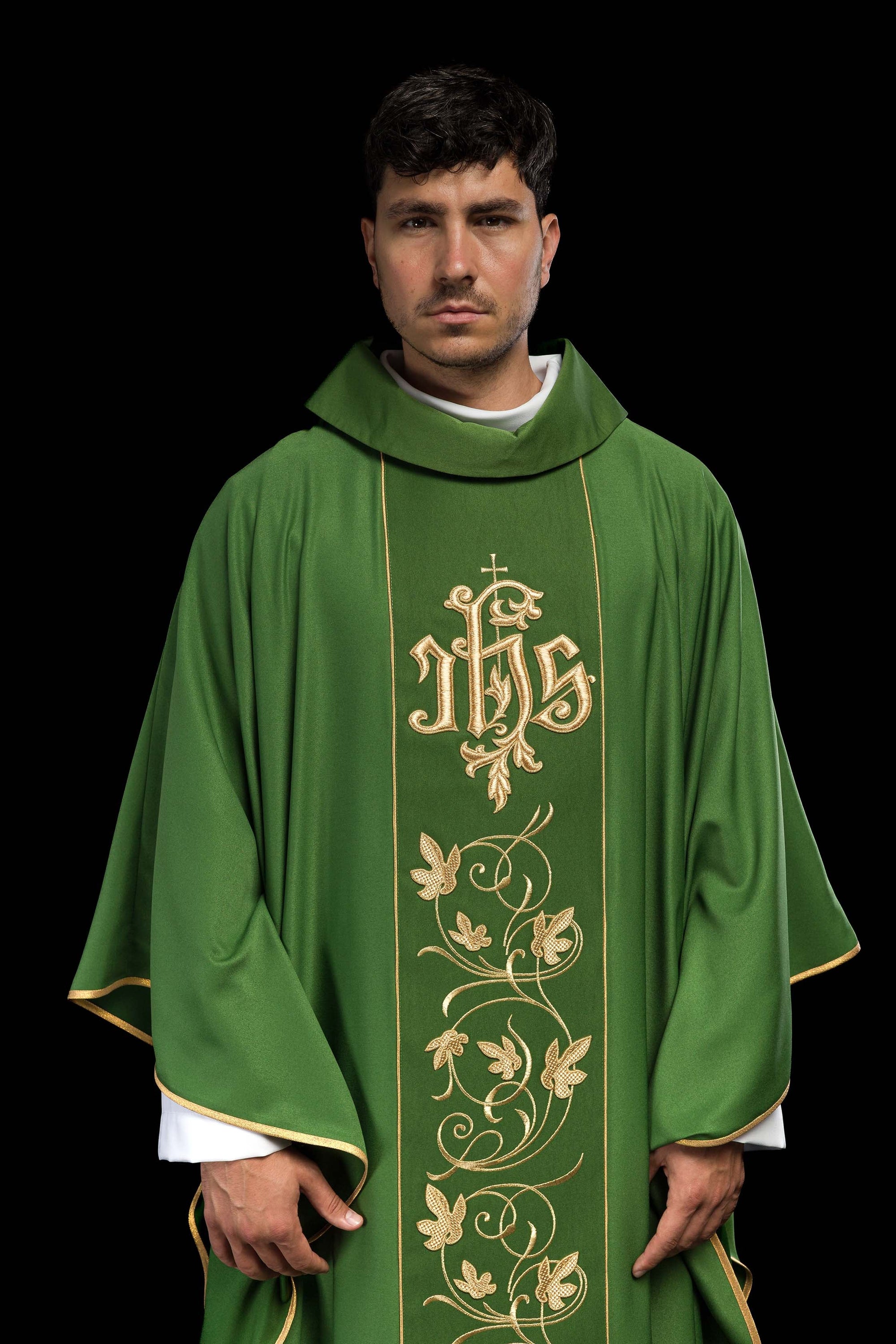 Green liturgical chasuble with richly decorated belt with floral motif and IHS
