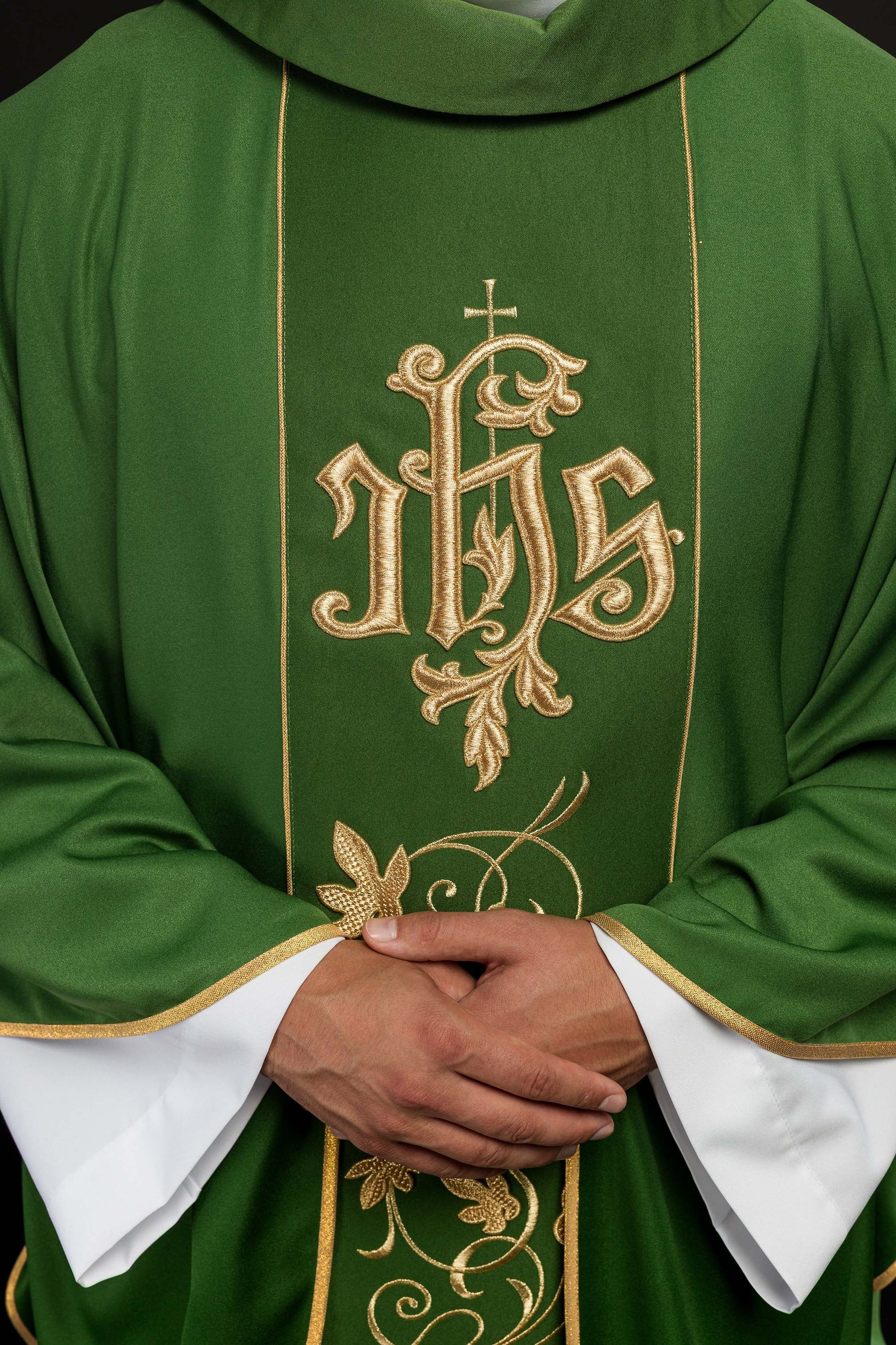 Green liturgical chasuble with richly decorated belt with floral motif and IHS