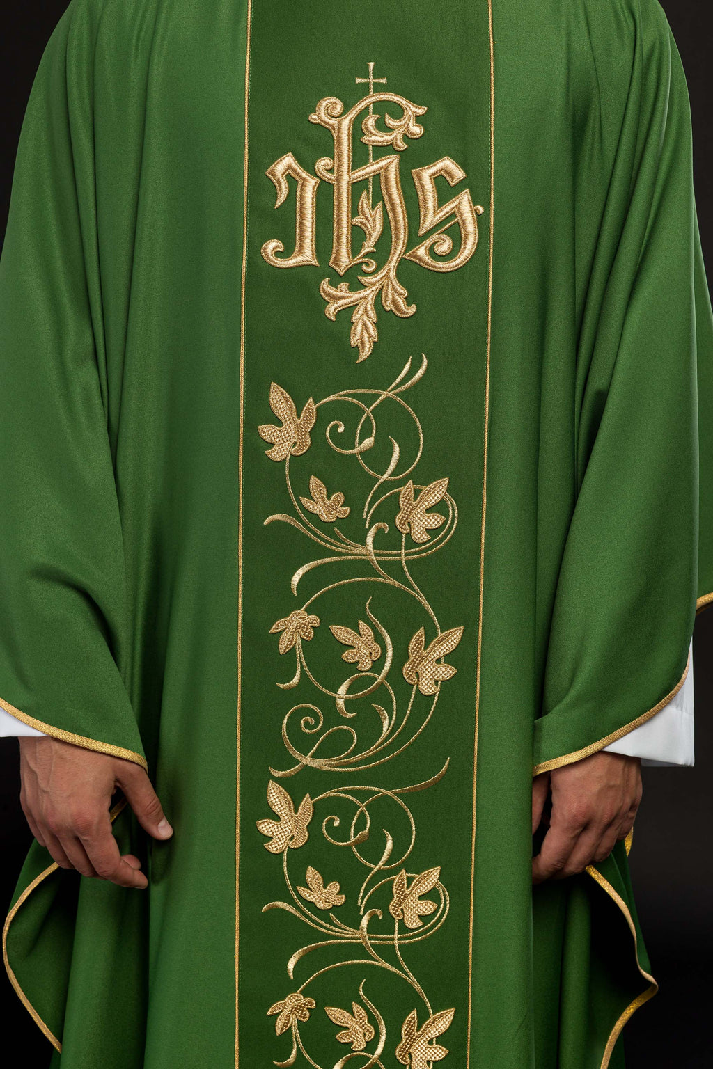 Green liturgical chasuble with richly decorated belt with floral motif and IHS